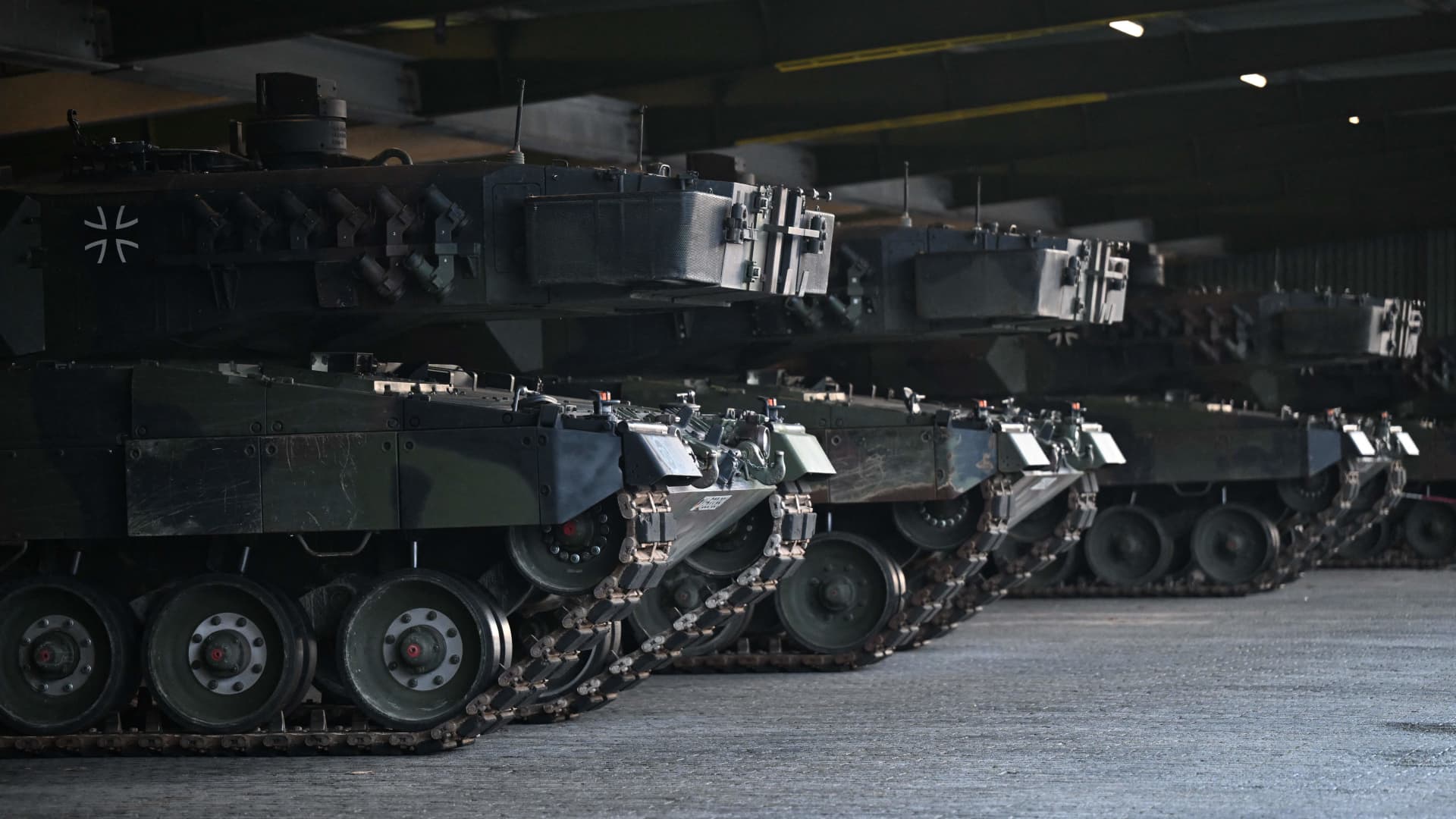 Leopard 2 tanks destined for Ukraine delivery stand parked at the training ground in Augustdorf, western Germany on February 1, 2023, during a visit of the German Defence Minister of the Bundeswehr Tank Battalion 203, to learn about the performance of the Leopard 2 main battle tank.