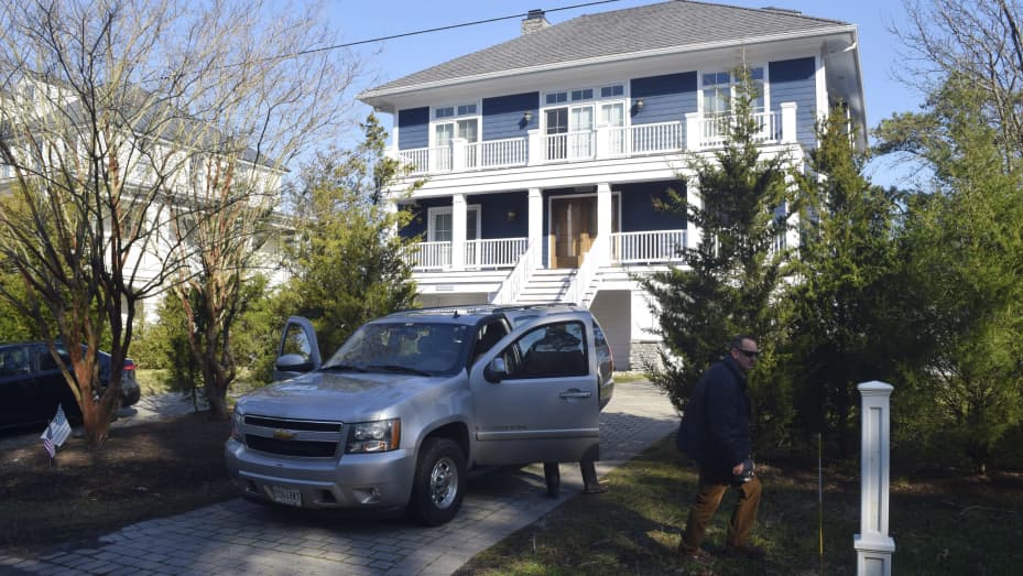 U.S. Secret Service agents are seen in front of Joe Biden's Rehoboth Beach, Del., home on Jan. 12, 2021. The FBI is conducting a planned search of President Joe Biden's Rehoboth Beach, Delaware home as part of its investigation into the potential mishandling of classified documents. That's according to a statement from Biden's personal lawyer.