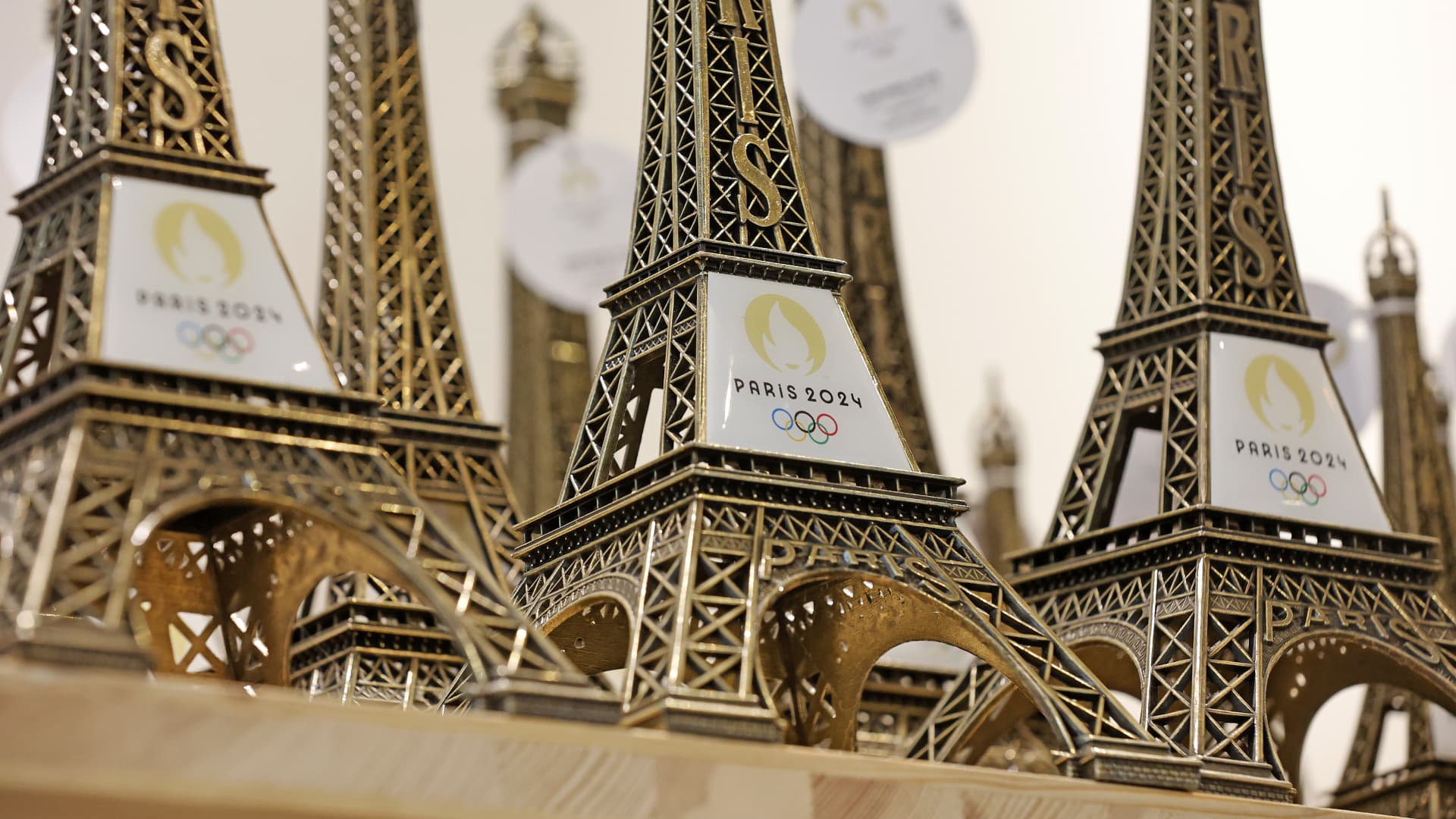 Replicas of the Eiffel Tower with the logo of the 2024 Olympic Games for the Paris 2024 Summer Olympic and Paralympic Games are displayed inside the official store entirely dedicated to the 2024 Olympic Games on November 15, 2022 in Paris, France.