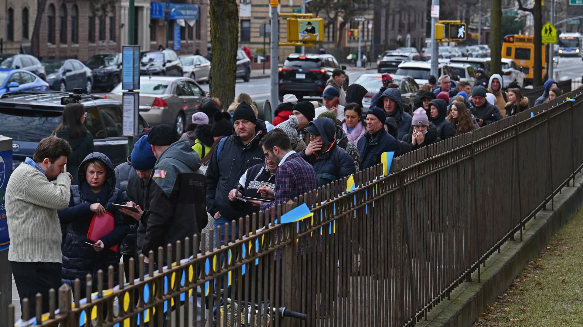 Ukrainian refugees stand in line to attend a job fair in the Brooklyn borough of New York on February 01, 2023. 