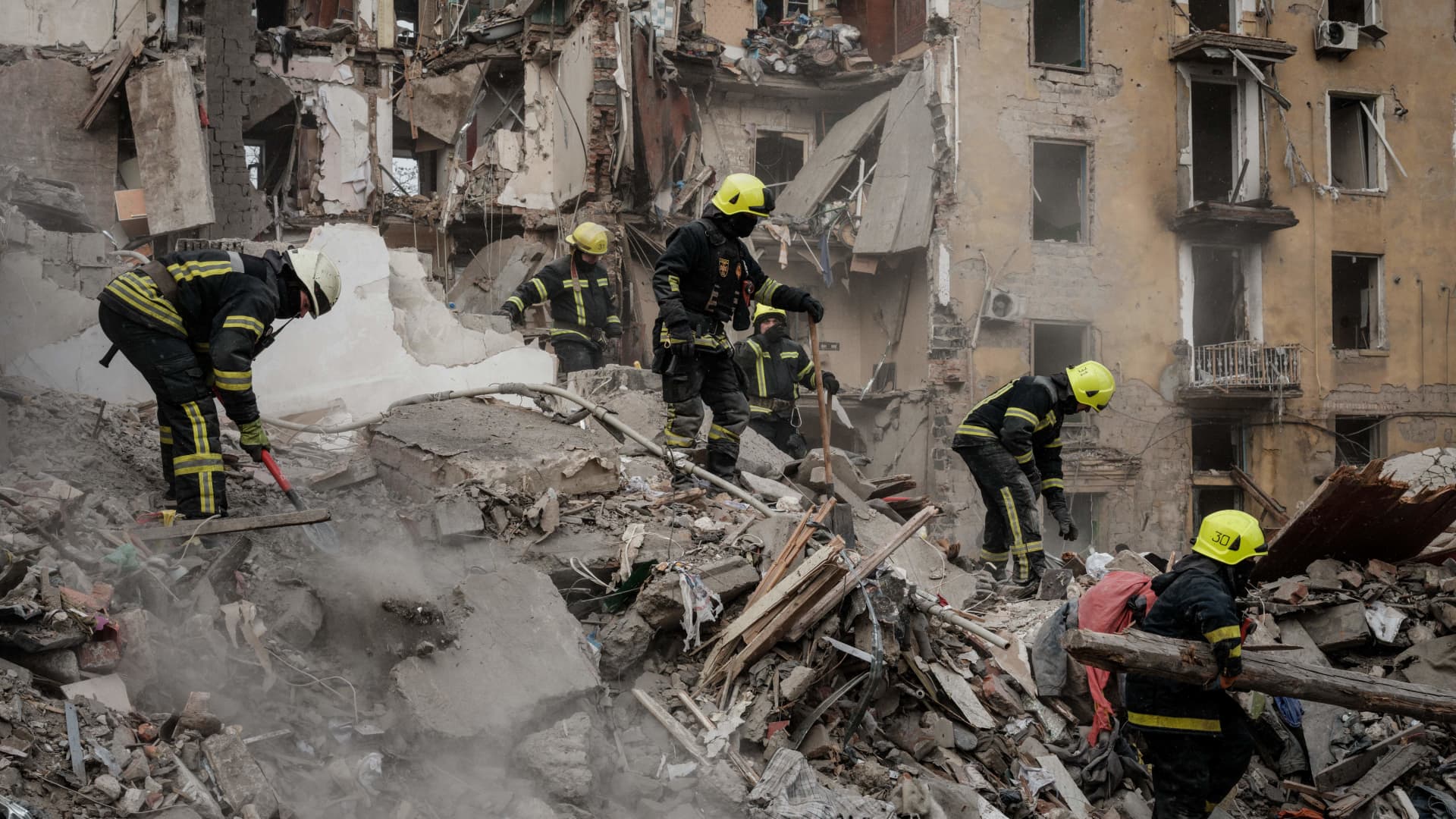 Firefighters work among debris of a building destroyed by a rocket strike in Kramatorsk on Feb. 2, 2023, amid the Russian invasion of Ukraine.
