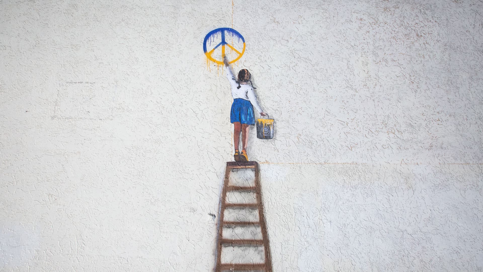 An art work by famous Italian street artist Tvboy created on a wall of a local school in the center of the town of Bucha, near Kyiv, Ukraine, on February 2, 2023. 