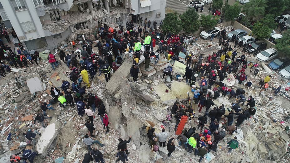 People search through rubble following an earthquake in Adana, Turkey February 6, 2023. Ihlas News Agency (IHA) via REUTERS ATTENTION EDITORS - THIS PICTURE WAS PROVIDED BY A THIRD PARTY. NO RESALES. NO ARCHIVES. TURKEY OUT. NO COMMERCIAL OR EDITORIAL SALES IN TURKEY.      TPX IMAGES OF THE DAY