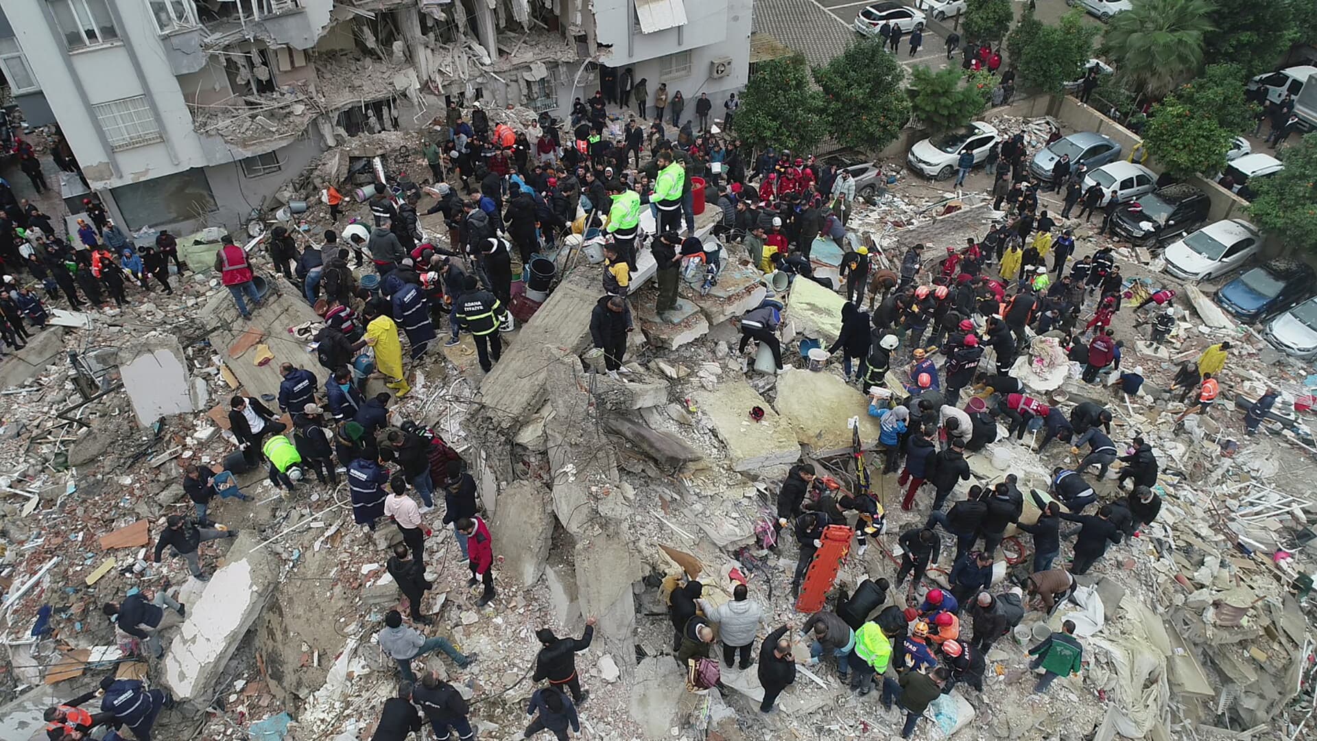 People search through rubble following an earthquake in Adana, Turkey February 6, 2023. 