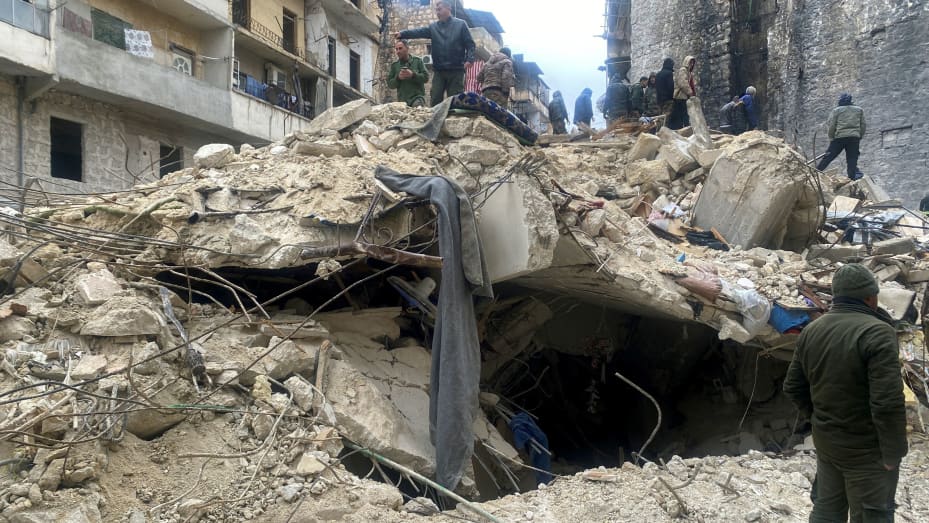 People search for survivors under the rubble, following an earthquake, in Aleppo, Syria February 6, 2023.
