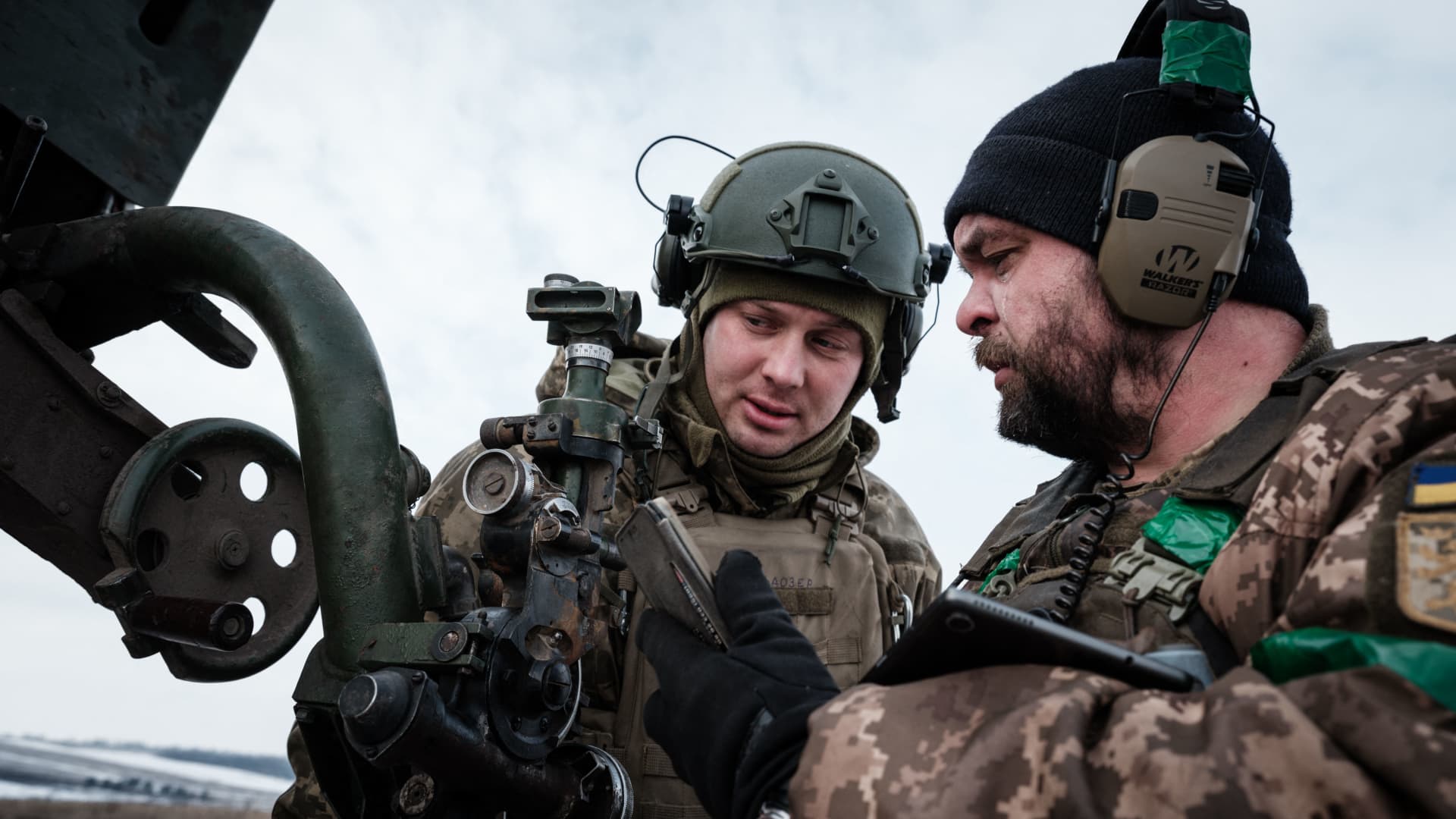 Ukrainian servicemen of the artillery unit of the 80th Air Assault Brigade talk near Bakhmut, Ukraine, on Feb. 7, 2023.