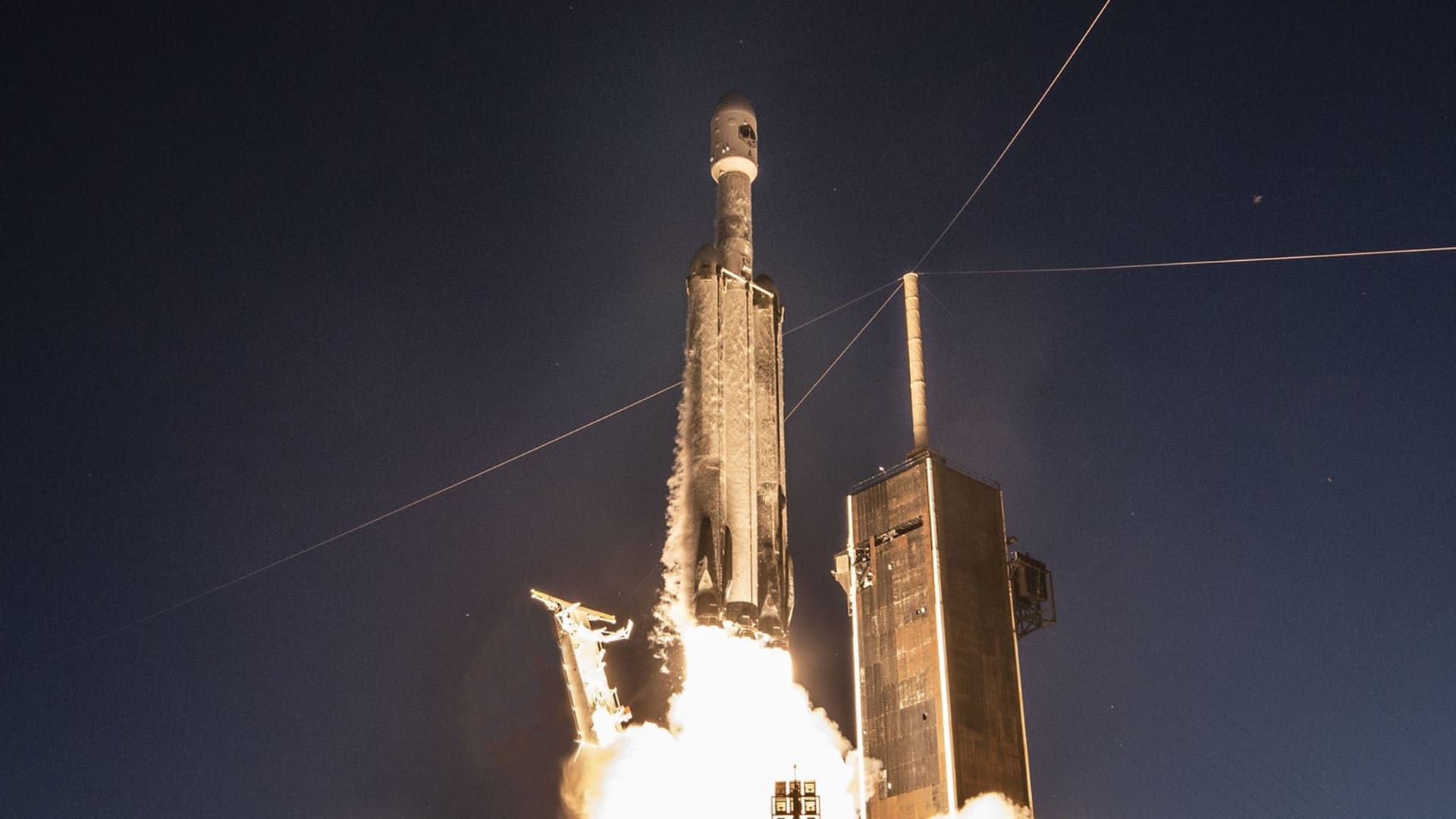 A Falcon Heavy rocket launches the USSF-67 mission on January 15, 2023 from NASA's Kennedy Space Center in Florida.