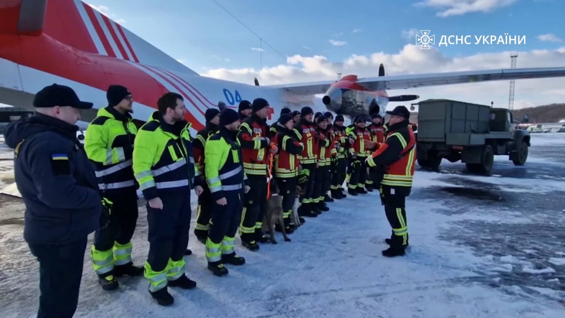 Rescuers of the State Emergency of Ukraine board a plane, on their way to help find survivors of the deadly earthquake in Turkey, at an unknown location in Ukraine February 7, 2023. 