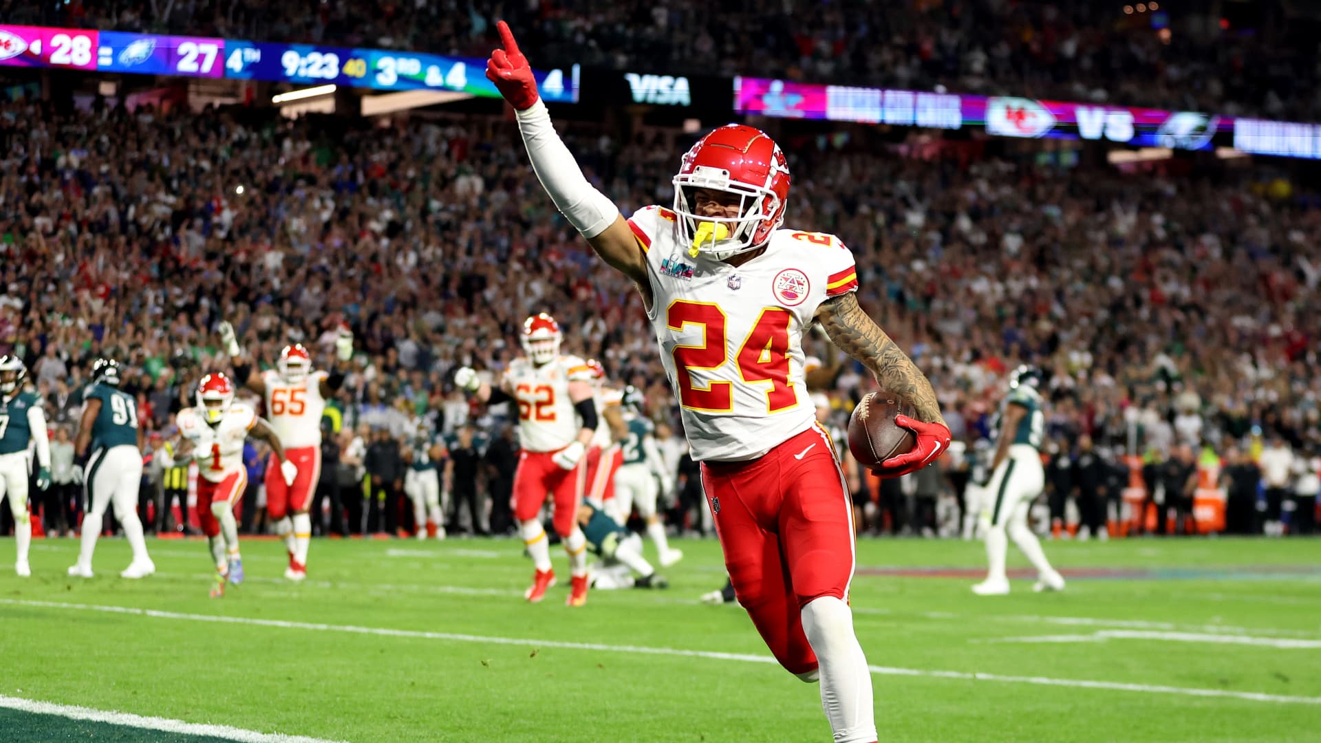 Skyy Moore #24 of the Kansas City Chiefs celebrates after scoring on a 4 yard touchdown pass during the third quarter against the Philadelphia Eagles in Super Bowl LVII at State Farm Stadium on February 12, 2023 in Glendale, Arizona.