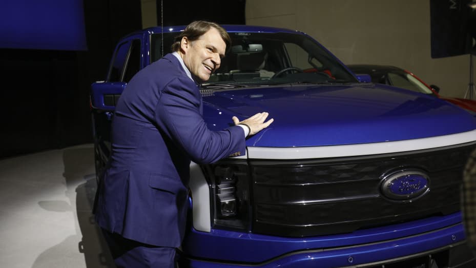 ROMULUS, MI - FEBRUARY 13: Ford CEO Jim Farley pats a Ford F-150 Lightning truck before announcing at a press conference that Ford Motor Company will be partnering with the world's largest battery company, a China-based company called Contemporary Amperex Technology,  to create an electric-vehicle battery plant in Marshall, Michigan, on February 13, 2023 in Romulus, Michigan. Part of a multi-billion dollar investment, the battery plant will provide approximately 2,500 jobs. (Photo by Bill Pugliano/Getty Ima