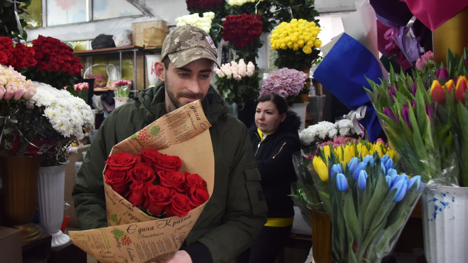 A man buys flowers at a flower market on Valentine's Day during the Russo-Ukrainian war in Lviv, Ukraine on February 14, 2023.