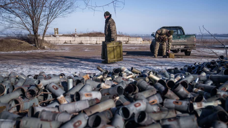 A Helicopter crew member of the 18th Separate Army Aviation Brigade carries boxes of ammunition, in eastern Ukraine on February 9, 2023 amid Russia's military invasion on Ukraine.