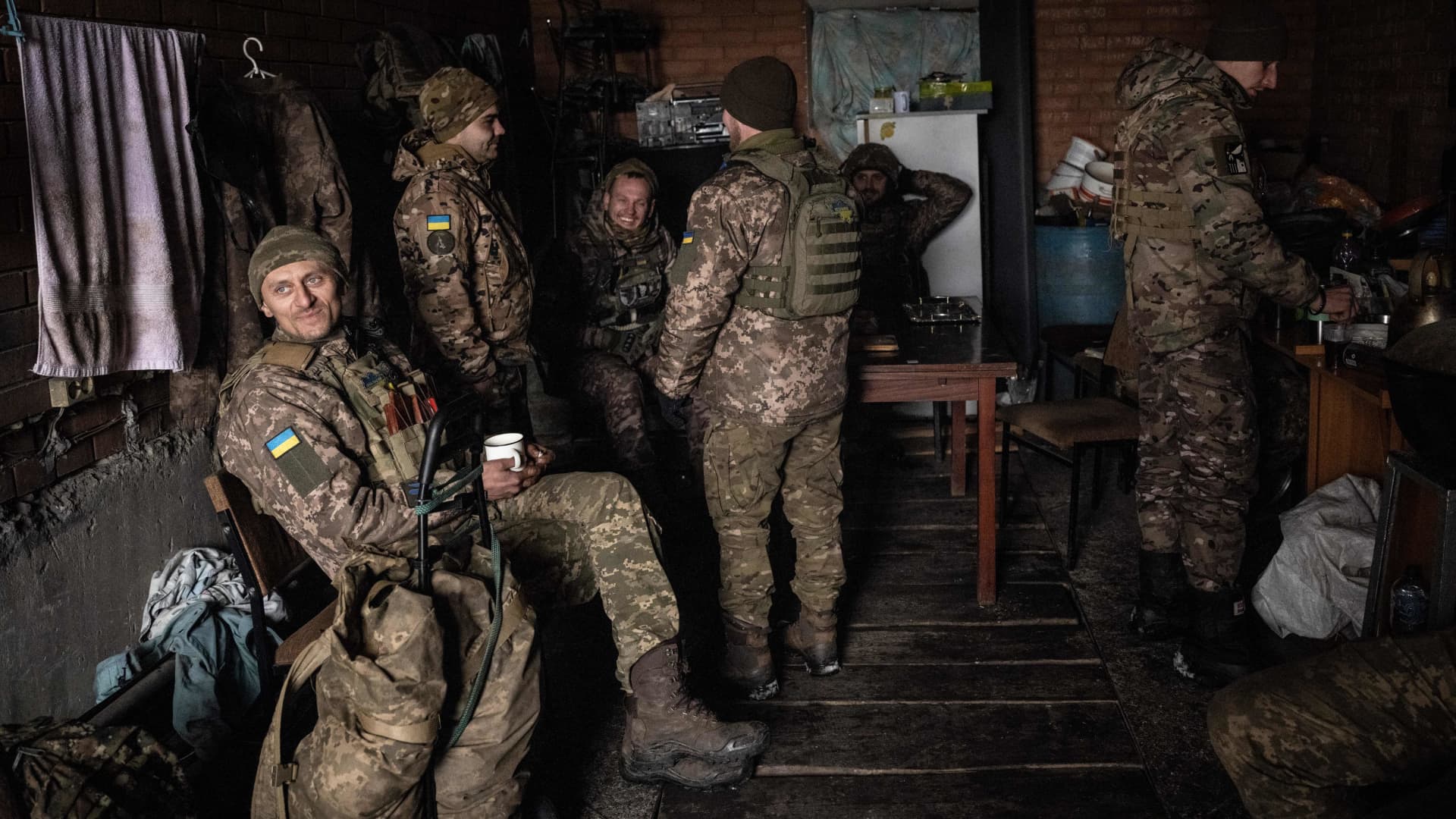 Ukrainian servicemen of the 93rd brigade await a fire-mission order for their French 120mm rifled towed mortar (designated as a MO-120-RT-61) position, in Bakhmut on February 15, 2023, amid the Russian invasion of Ukraine. 
