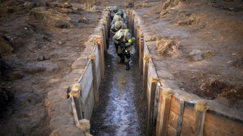 UNSPECIFIED - FEBRUARY 16: Ukrainian soldiers take part in a trench warfare training exercise on February 16, 2023 in an unspecified location in the United Kingdom. The training programme is part of the UK's commitment to supporting Ukraine in its fight against Russia's unprovoked invasion as we approach the first anniversary of the war on February 24. The latest cohort of Ukrainian volunteers marks the 10,000th  recruit to be trained in the United Kingdom. A thousand UK service personnel are deployed to ru