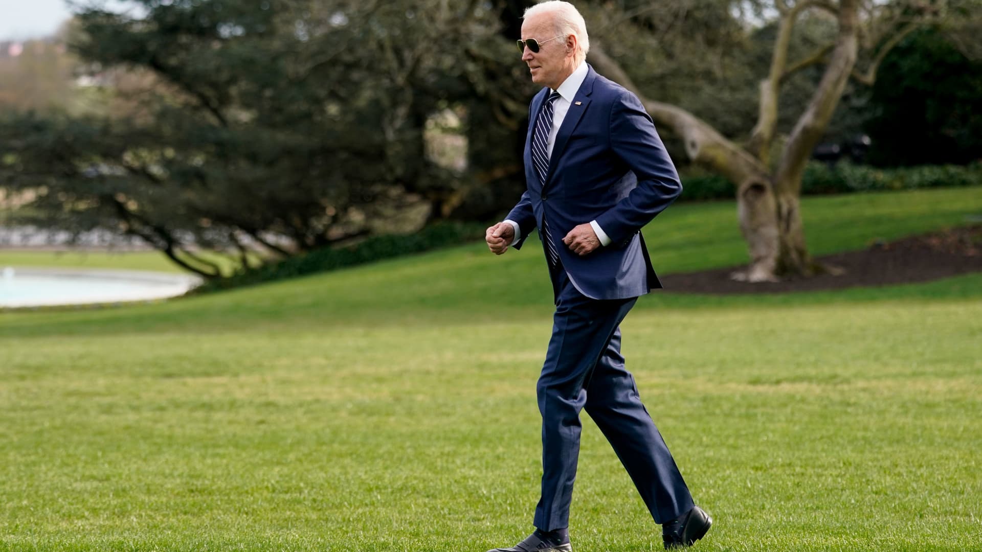 President Joe Biden jogs across the South Lawn of the White House to speak with visitors before boarding Marine One, Friday, March 18, 2022, in Washington. Biden turns 80 on Sunday, Nov. 20.