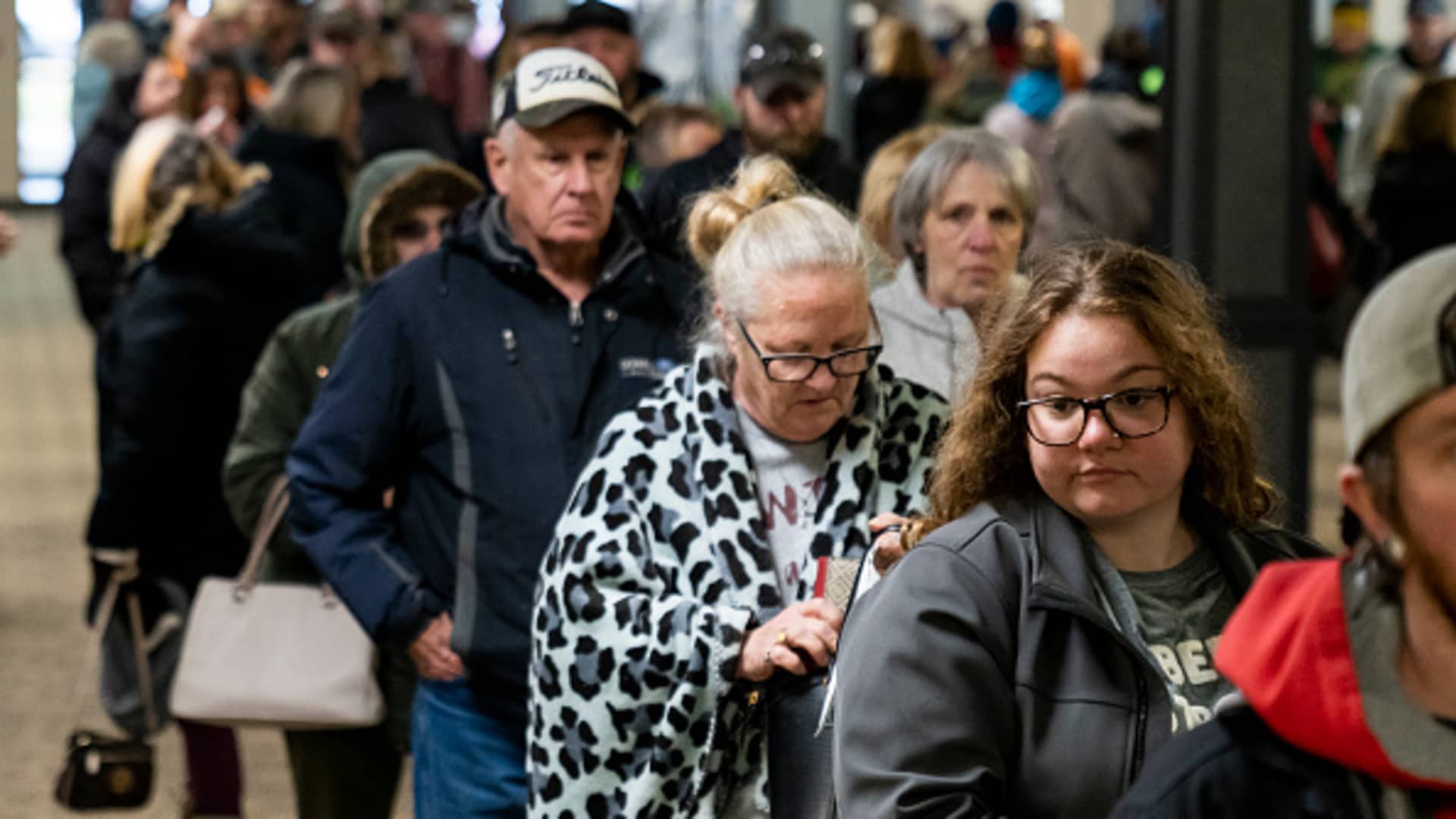 People wait in line at the Norfolk Southern Assistance Center to collect a $1000 check and get reimbursed for expenses while they were evacuated following a train derailment prompting health concerns on February 17, 2023 in East Palenstine, Ohio.