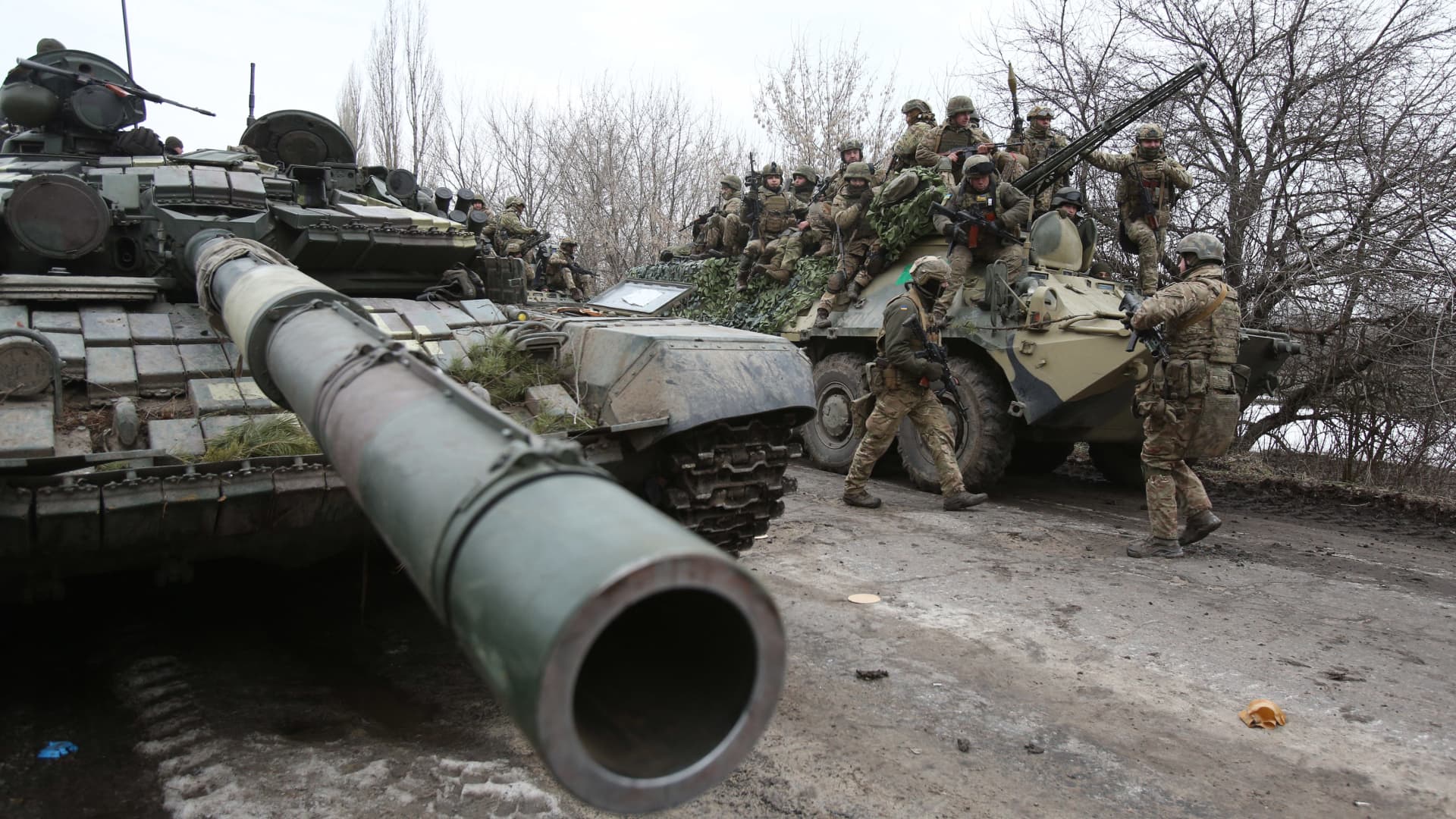 Ukrainian servicemen get ready to repel an attack in Ukraine's Lugansk region on Feb. 24, 2022.