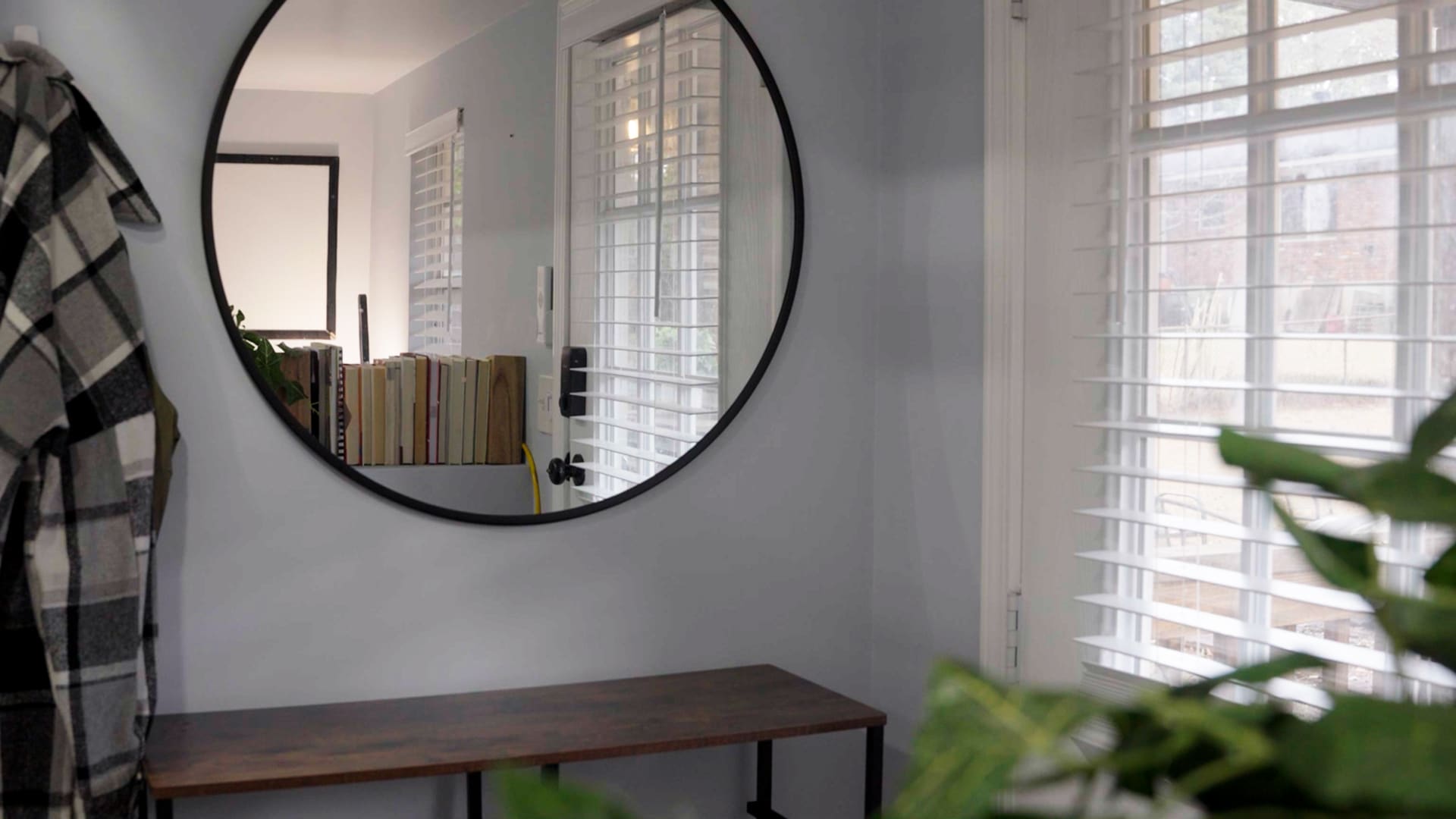 Small details like this mirror make the space feel larger and more homey. 