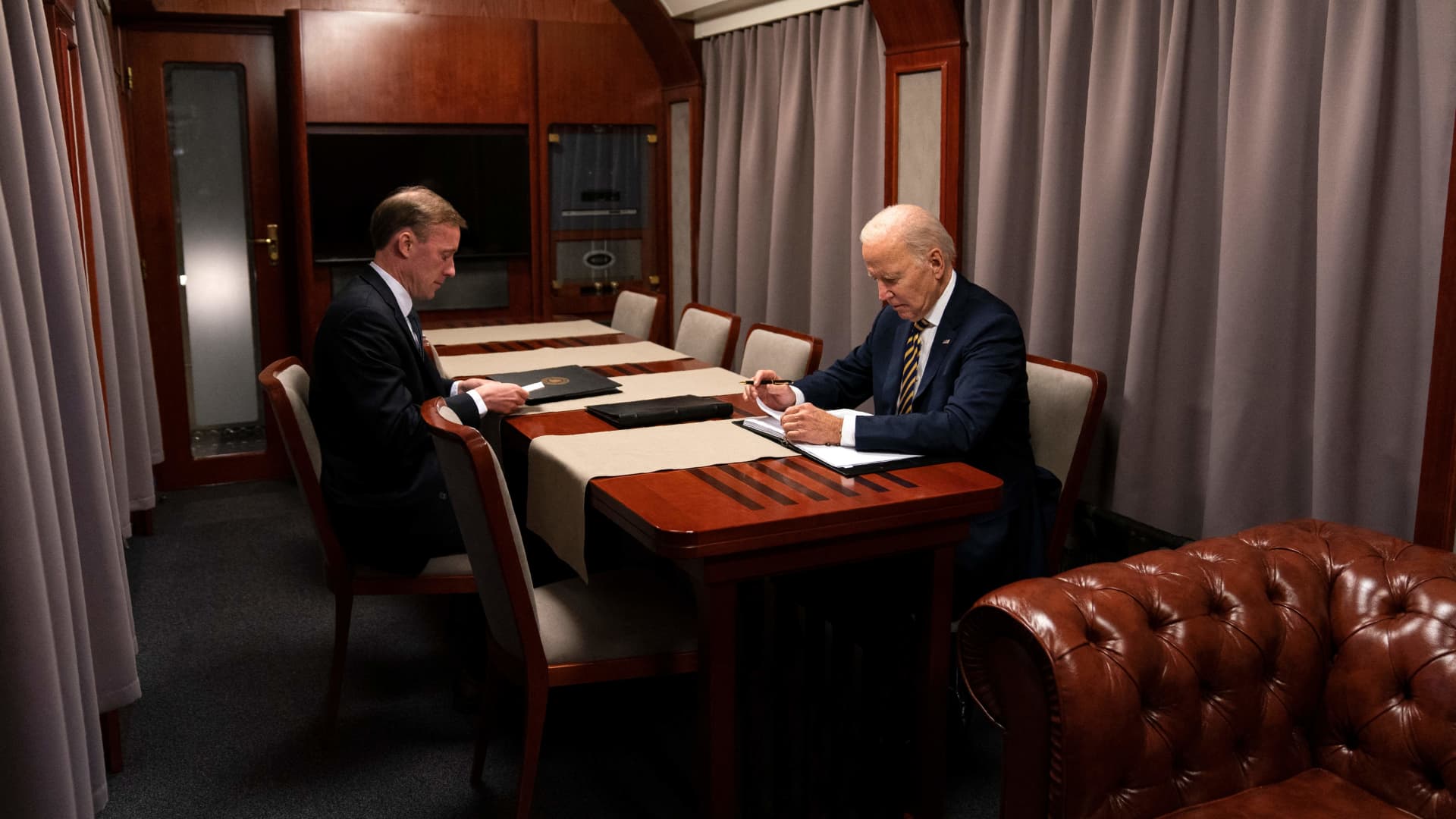 US President Joe Biden sits on a train with National Security Advisor Jake Sullivan after a surprise visit with Ukrainian President Volodymyr Zelenskyy, in Kyiv on February 20, 2023. (Photo by Evan Vucci / POOL / AFP) (Photo by EVAN VUCCI/POOL/AFP via Getty Images)