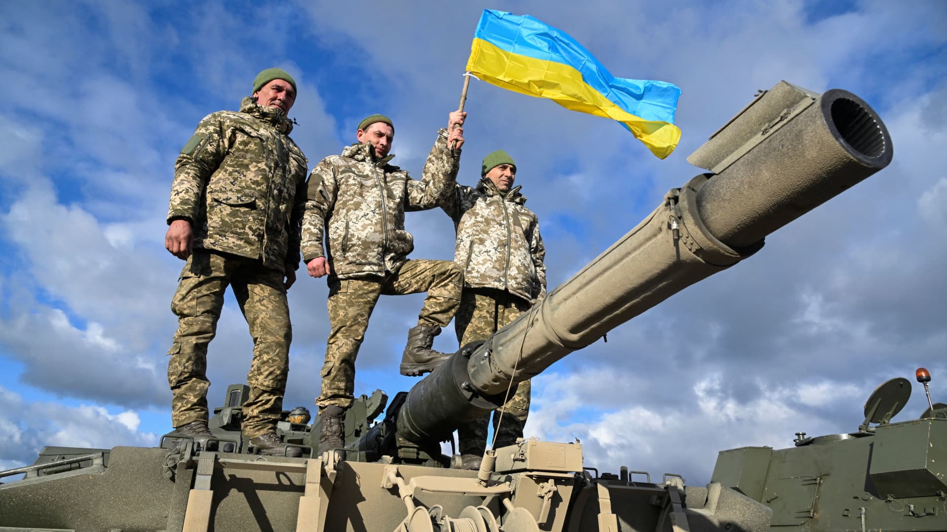 Ukrainian personnel on top of a Challenger 2 tank during training at Bovington Camp, near Wool in southwestern Britain, on Feb. 22, 2023.