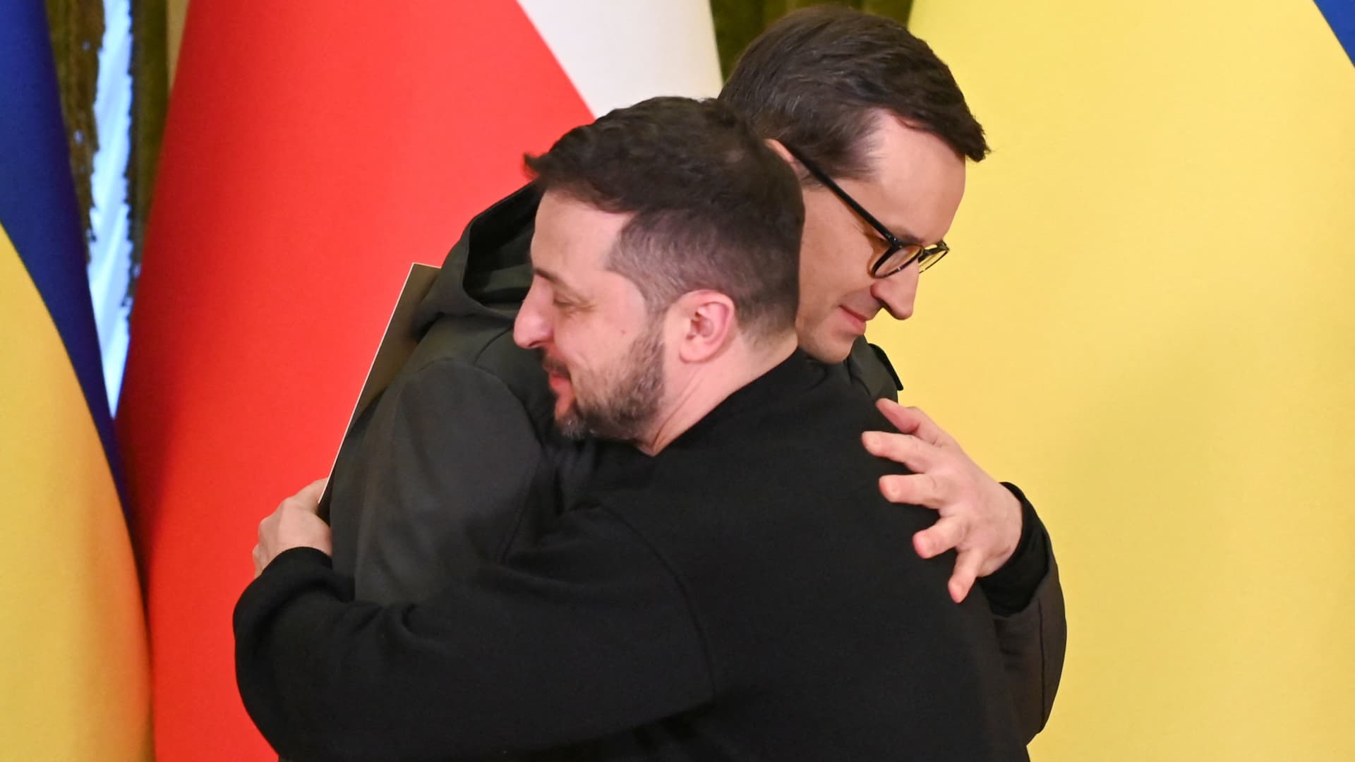 In happier times: Ukraine's President Volodymyr Zelensky and Polish Prime Minister Mateusz Morawiecki embrace during a joint news briefing on a day of the first anniversary of Russia's attack on Ukraine, in Kyiv, Ukraine February 24, 2023.