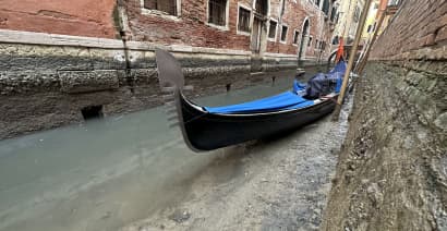 Photos show Venice’s canals running dry amid low tides
