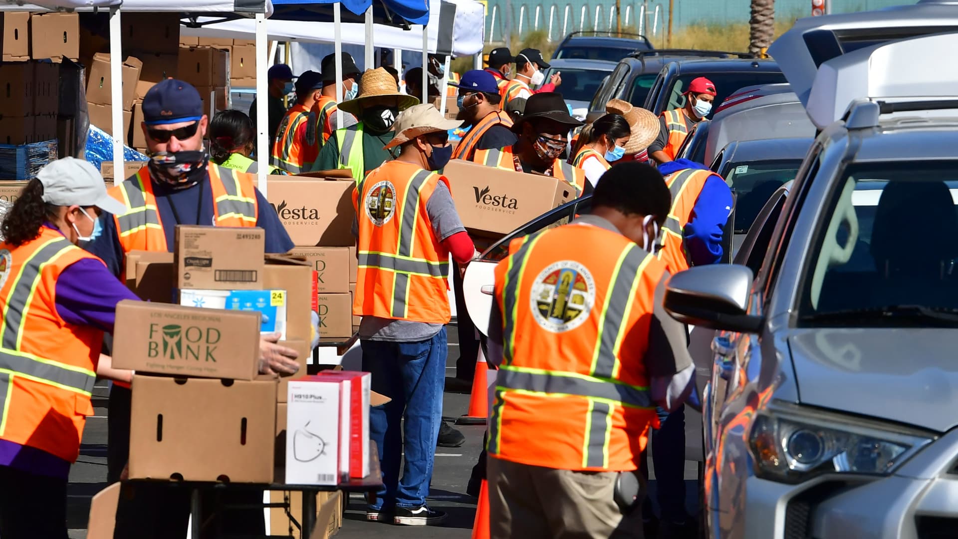 Los Angeles County Regional Food Bank workers help with food distribution in Willowbrook, California, on April 29, 2021.