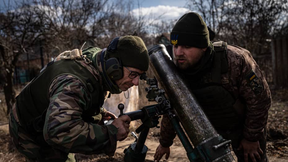 Ukranian soldiers of the 24th Separate Mechanized Brigade aim the mortar before a strike at an undisclosed location along the frontline near Toretsk, Donetsk, March 4 2023.