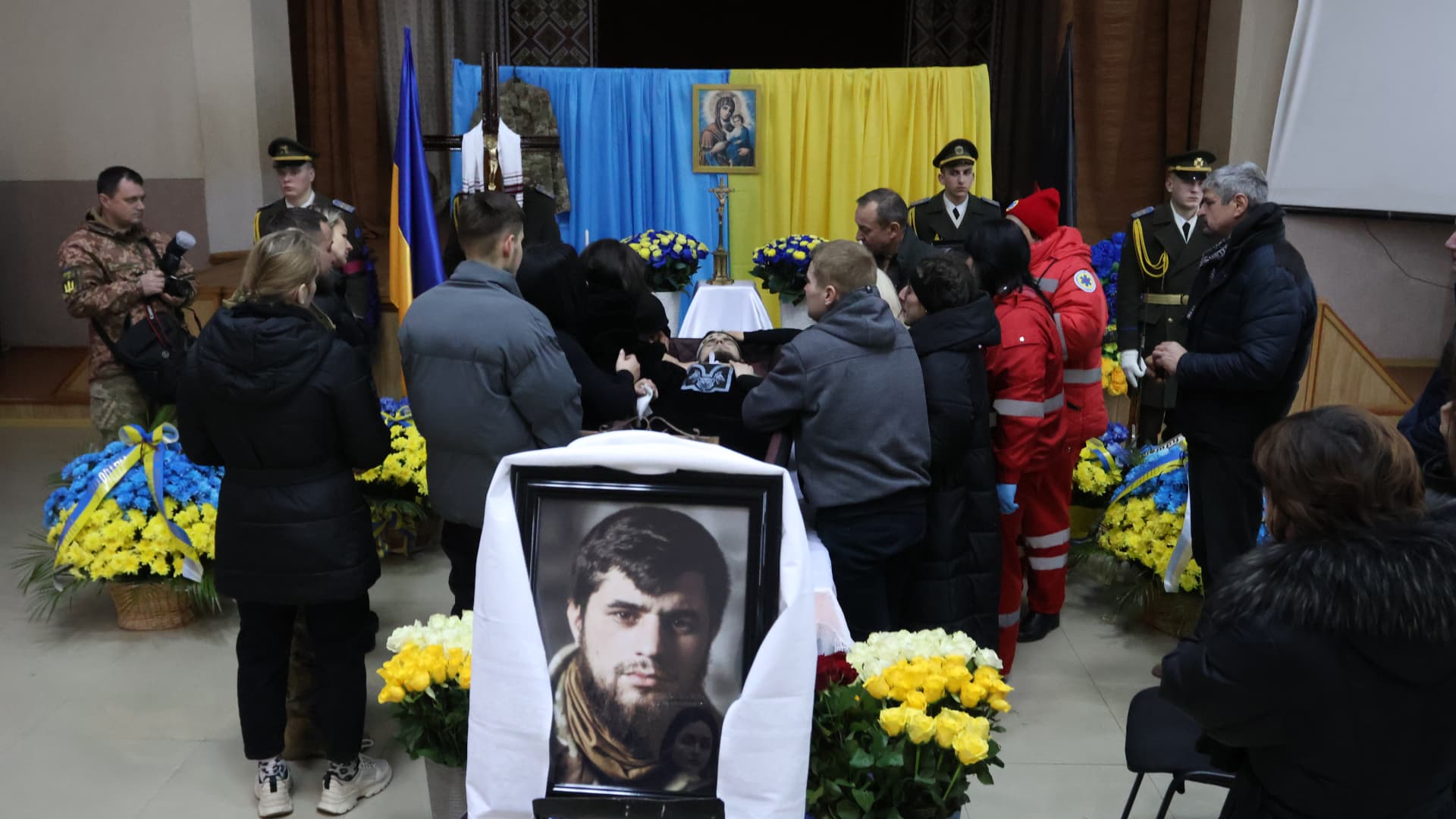  The family mourns near the coffin during the farewell ceremony for the Hero of Ukraine Dmytro Kotsiubailo “Da Vinci” on March 9, 2023 in Bovshiv, Ivano-Frankivsk Oblast, Ukraine. 