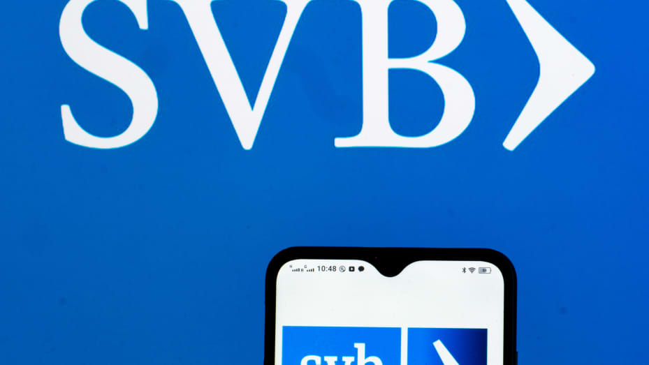 UKRAINE - 2021/10/07: In this photo illustration SVB Financial Group logo seen displayed on a smartphone and in the background. (Photo Illustration by Igor Golovniov/SOPA Images/LightRocket via Getty Images)