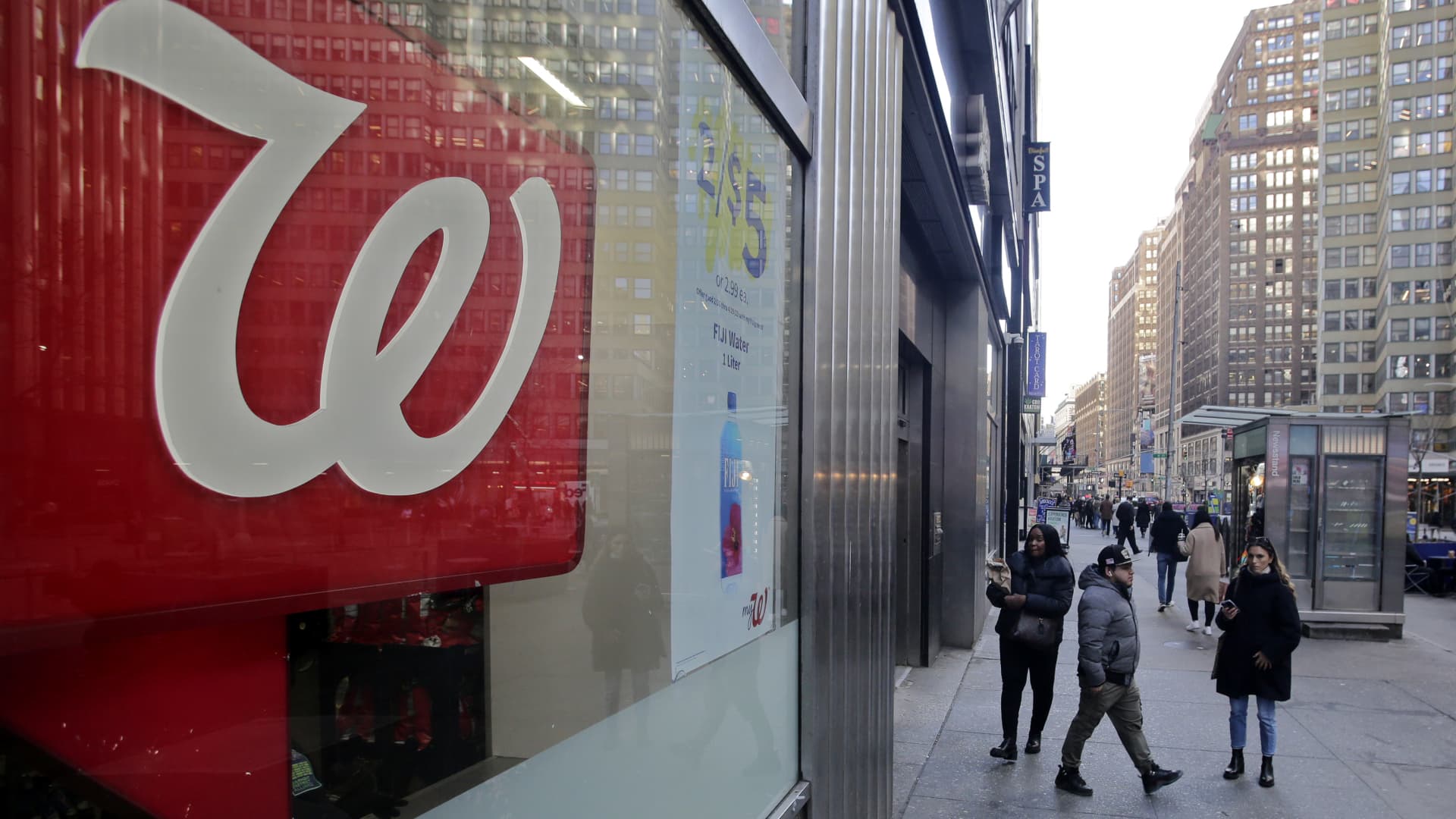 People make their way near a Walgreens pharmacy in New York City, March 9, 2023.