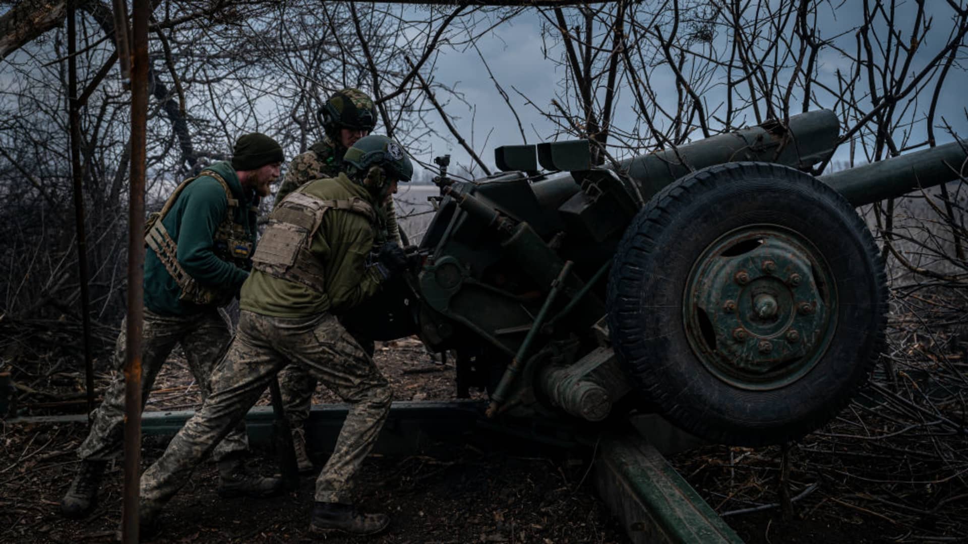 Ukrainian servicemen from the 10th Brigade aim a D-30 Howitzer towards Russian infantry along the frontline outside of Soledar, Ukraine on March 11, 2023.