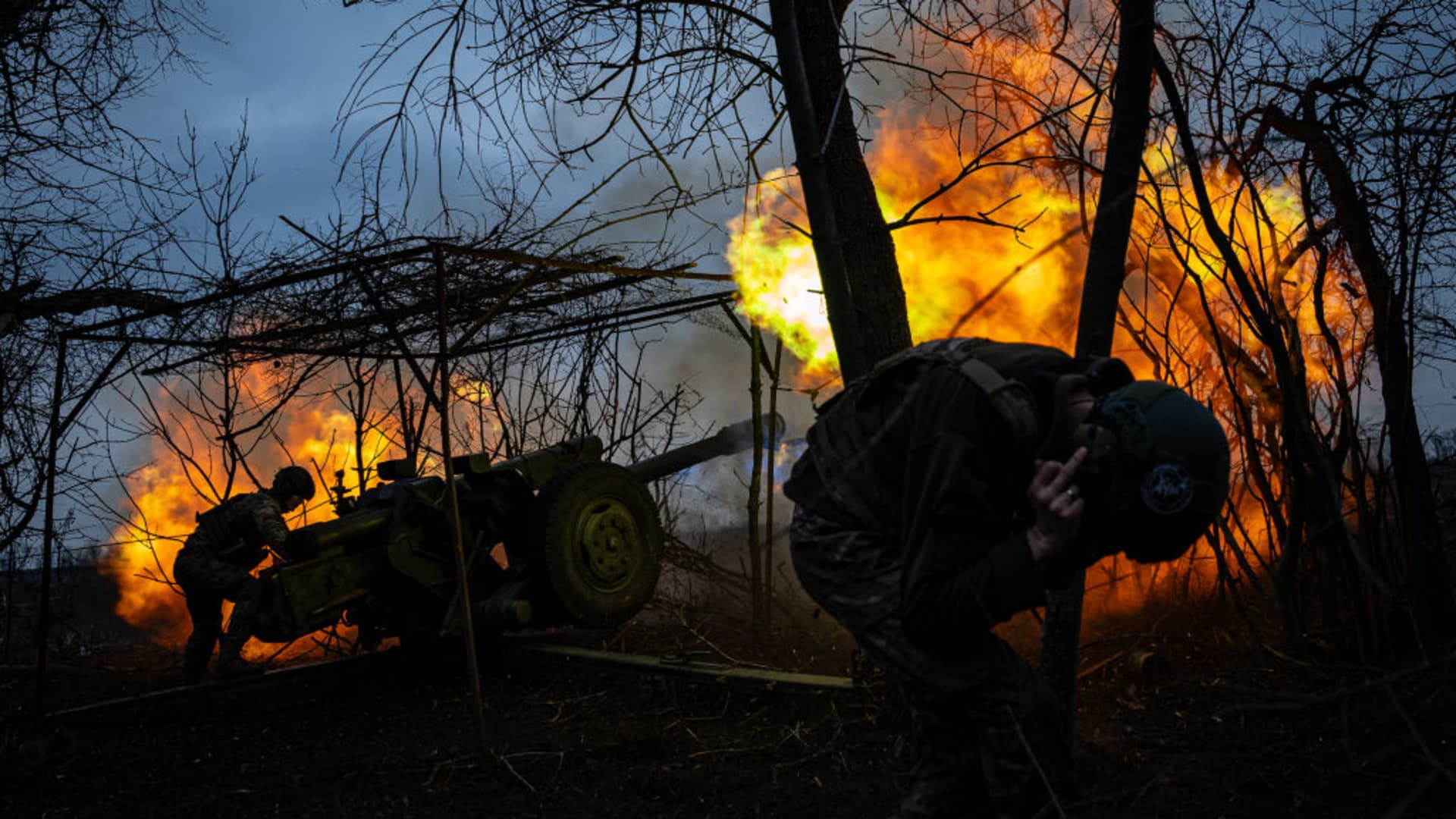Ukrainian servicemen from the 10th Brigade fire a D-30 Howitzer towards Russian infantry along the frontline outside of Soledar, Ukraine on March 11, 2023.