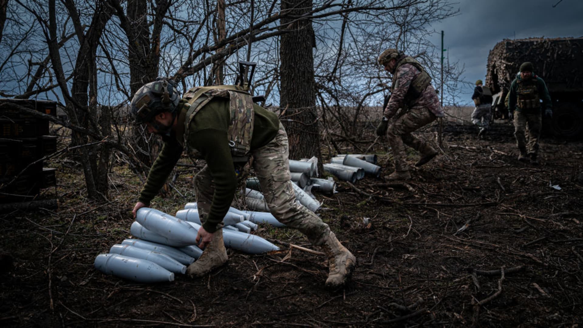 Ukrainian servicemen from the 10th Brigade unload heavy artillery ammunition at a position along the frontline outside of Soledar, Ukraine on March 11, 2023.