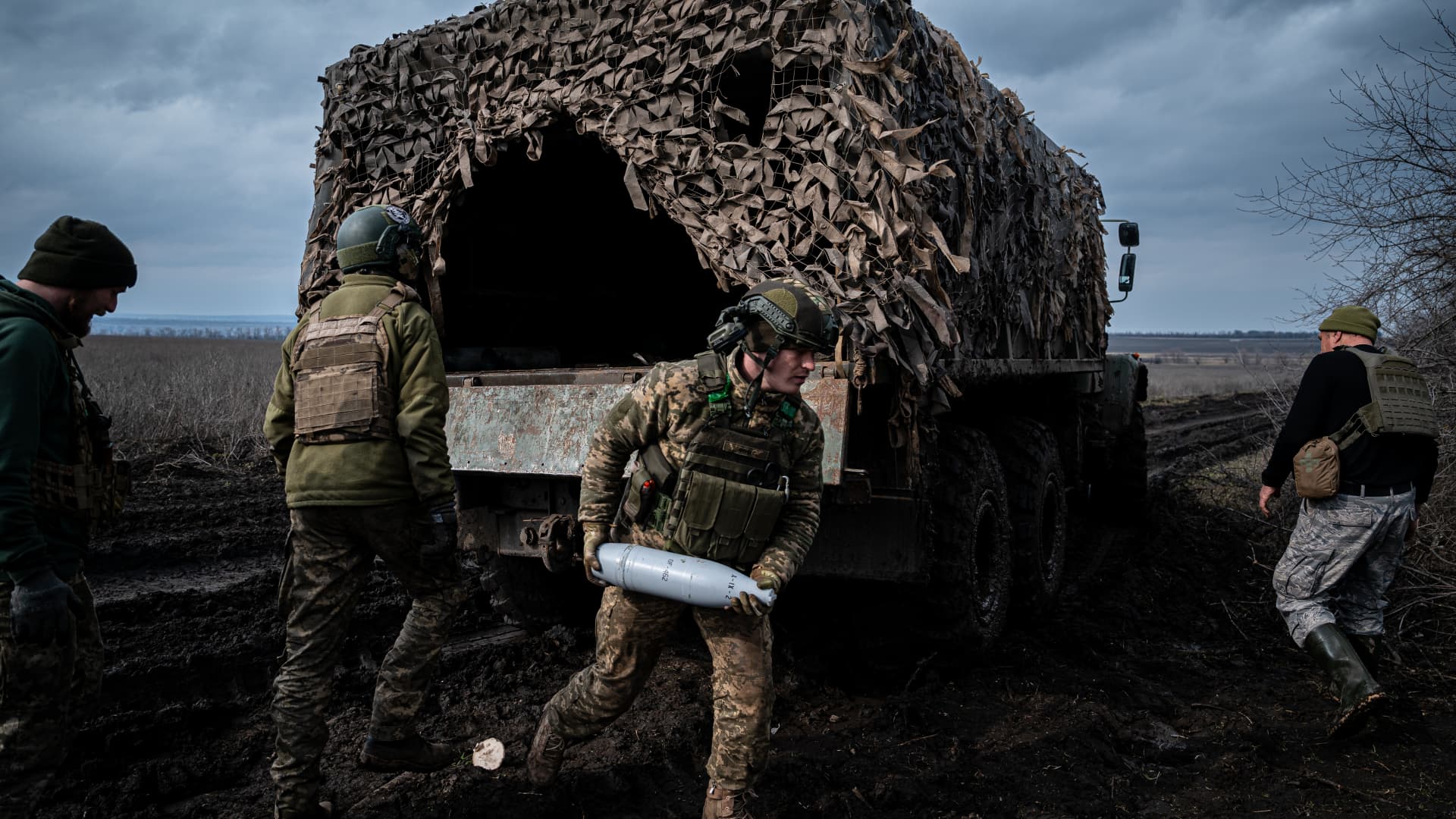 Ukrainian servicemen from the 10th Brigade unload heavy artillery ammunition at a position along the frontline outside of Soledar, Ukraine on March 11, 2023.