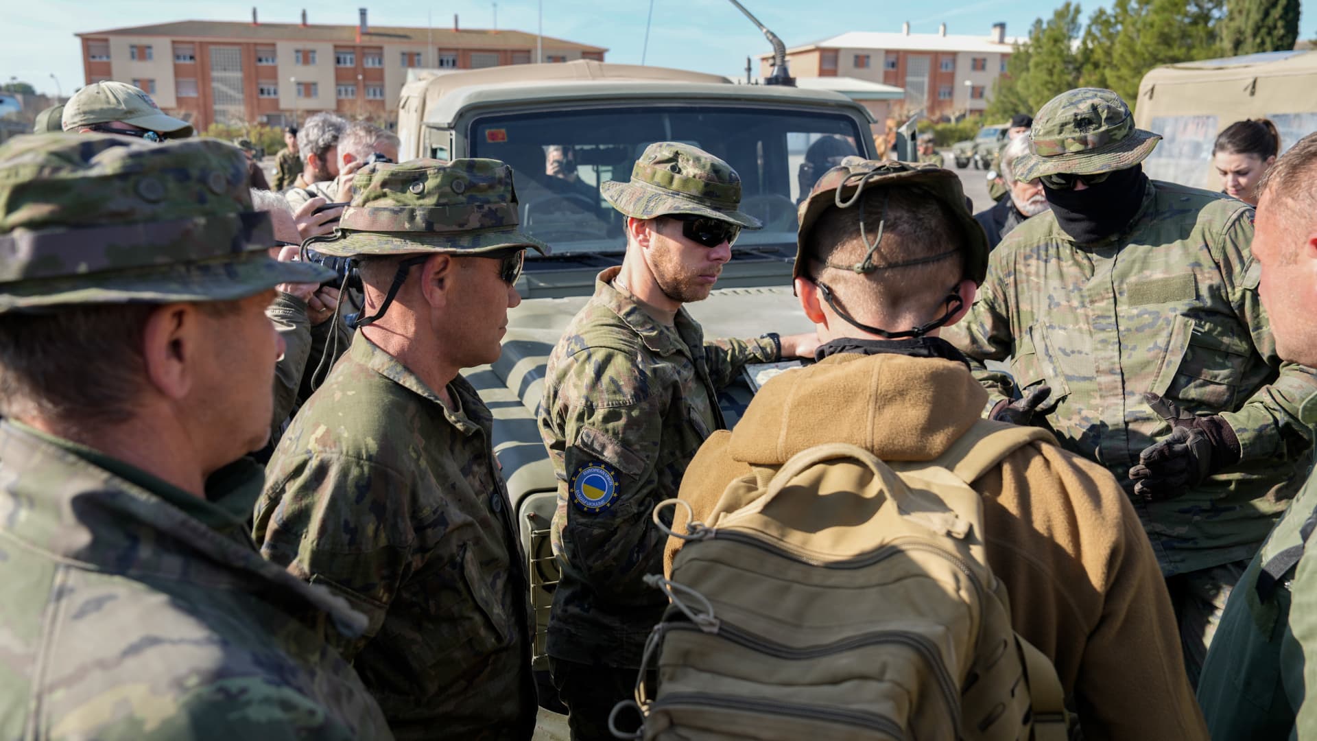 Ukrainian military personnel listen to a briefing ahead of a Leopard 2A4 tank training exercise conducted by the Spanish military, at the San Gregorio military base outside Zaragoza, Spain, on Monday, March 13, 2023. 