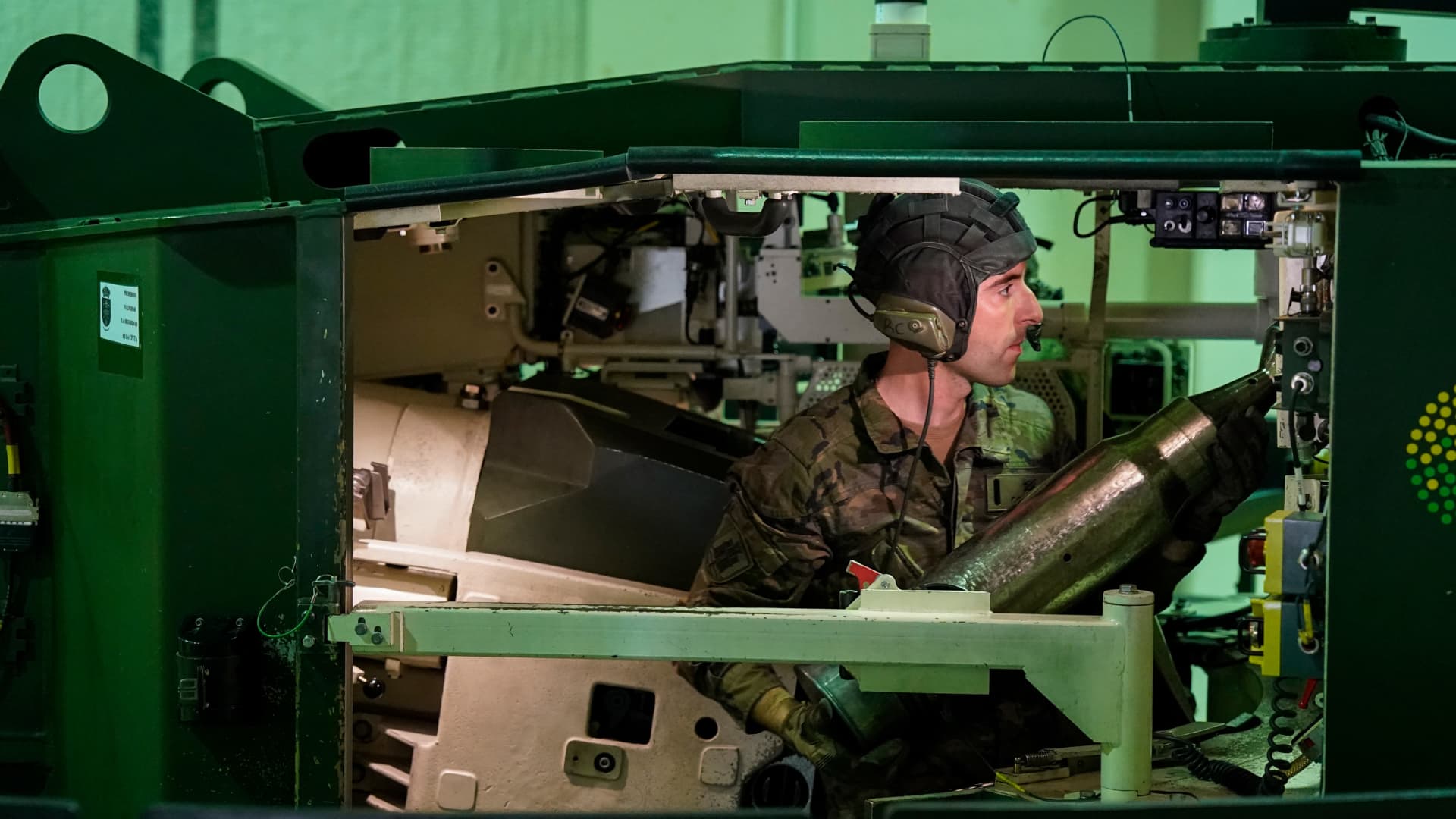 Spanish military personnel load dummy ammunition in a Leopard tank simulator during a training exercise, at the San Gregorio military base outside Zaragoza, Spain, on Monday, March 13, 2023.