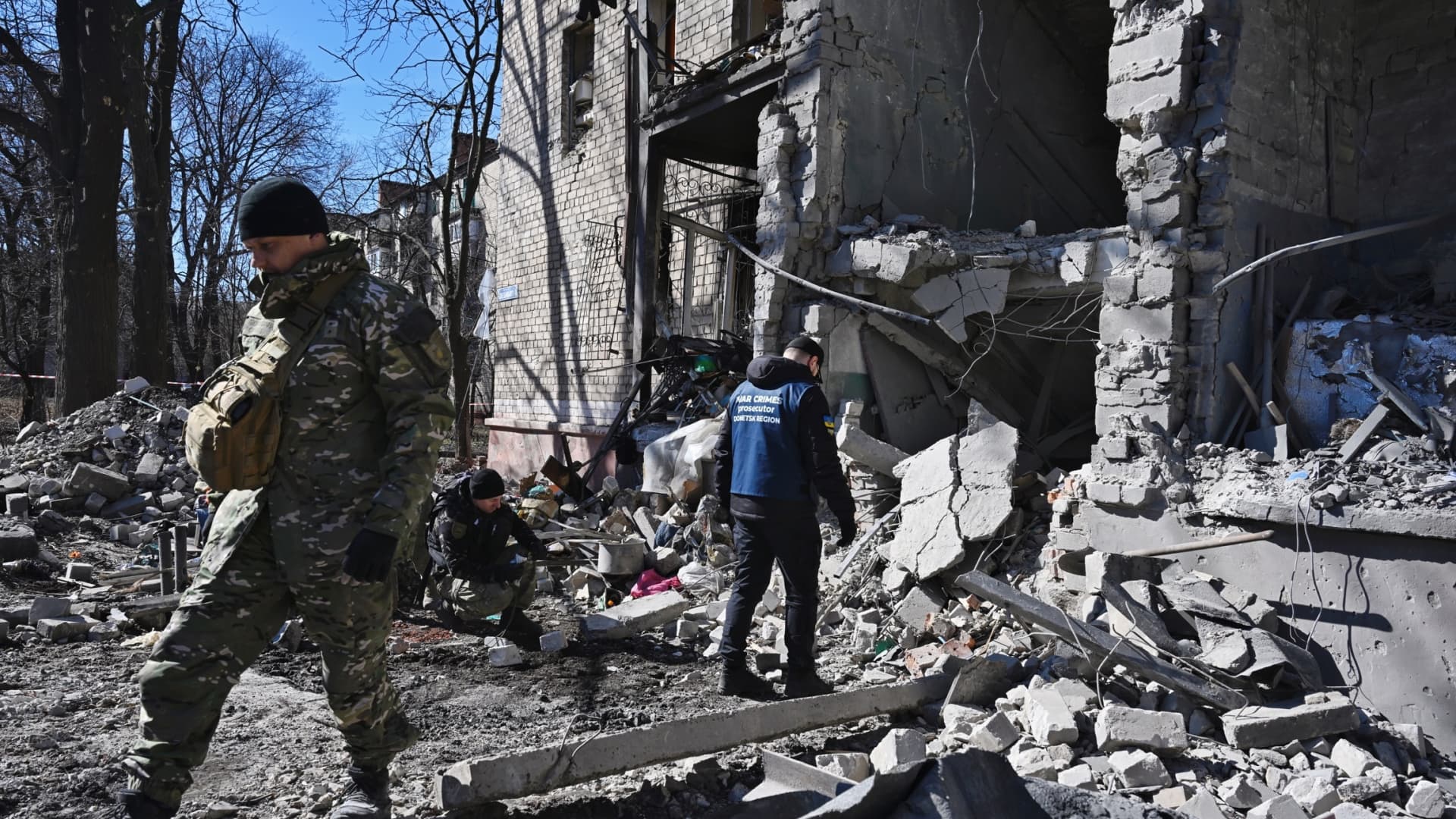 Members of the Ukrainian military inspect a site after a Russian missile attack on the center of Kramatorsk, Ukraine, on March 14, 2023.