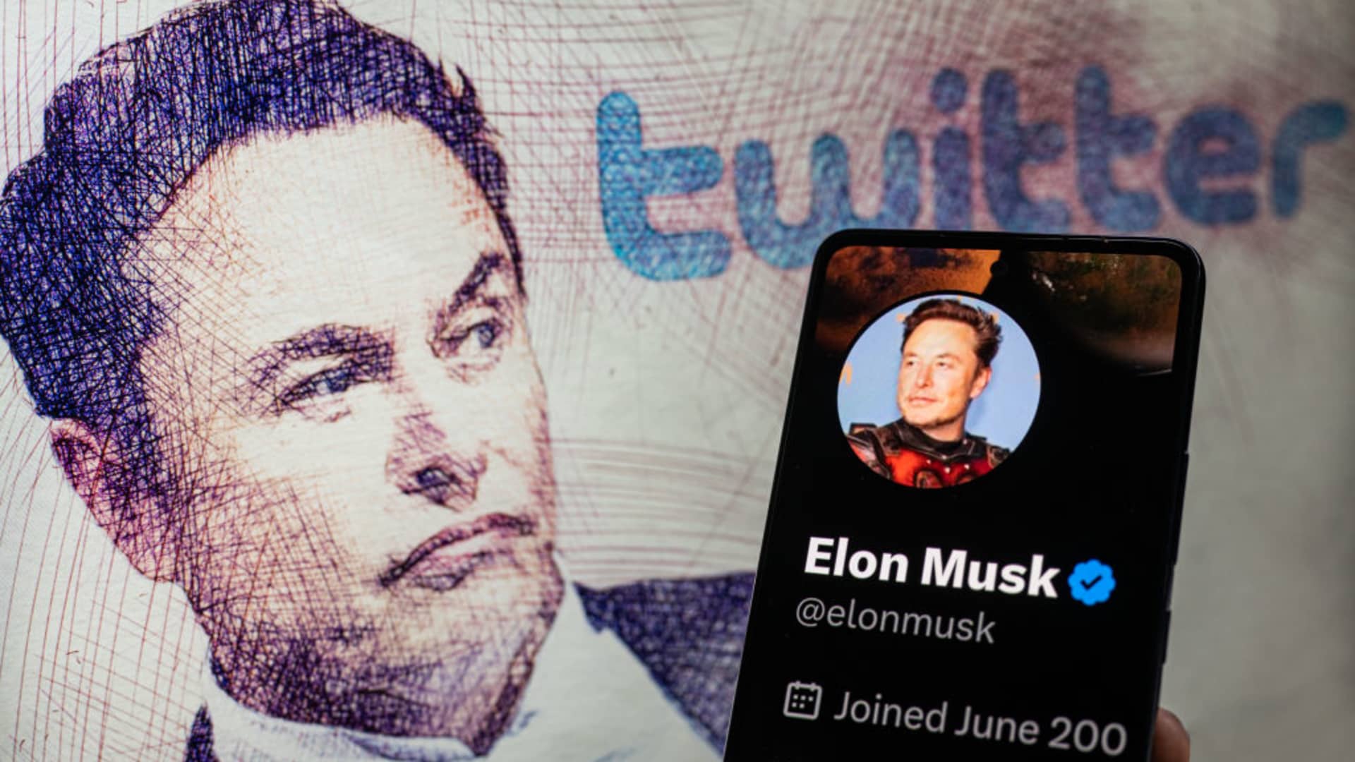 Elon Musk Twitter account seen on Mobile with Elon Musk in the background on screen, seen in this photo illustration. On 19 February 2023 in Brussels, Belgium.