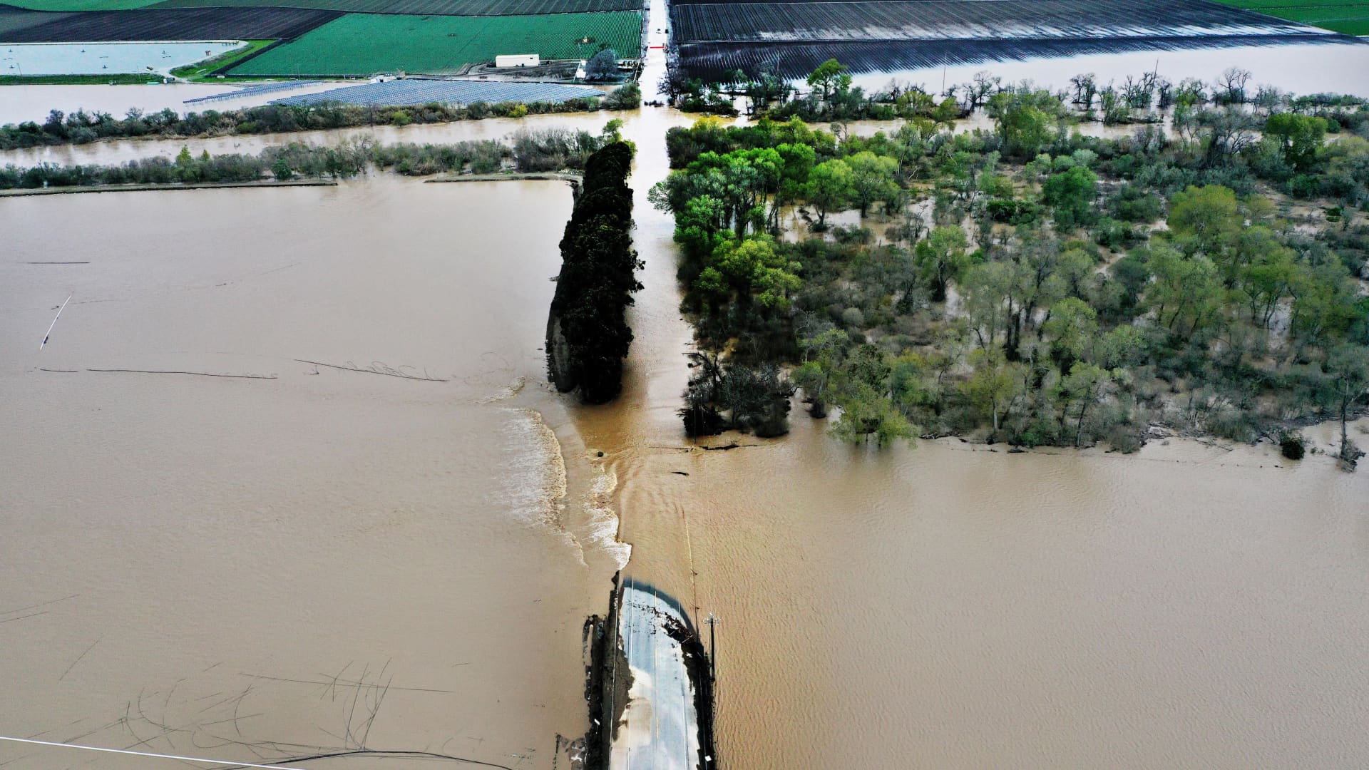 Strawberry fields and roads fill with flood waters as the Salinas River overflows breaking through levies during an atmospheric river storm which is again slamming California in Salinas, California on Tuesday March 14, 2023.