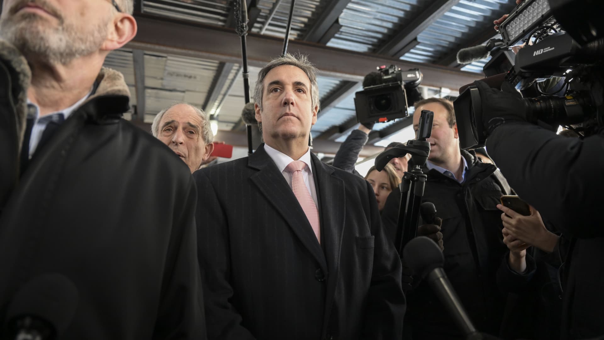 Michael Cohen (C), Donald Trump's former lawyer and fixer, walks out of a Manhattan courthouse after testifying before a grand jury, in New York, United States on March 15, 2023. 