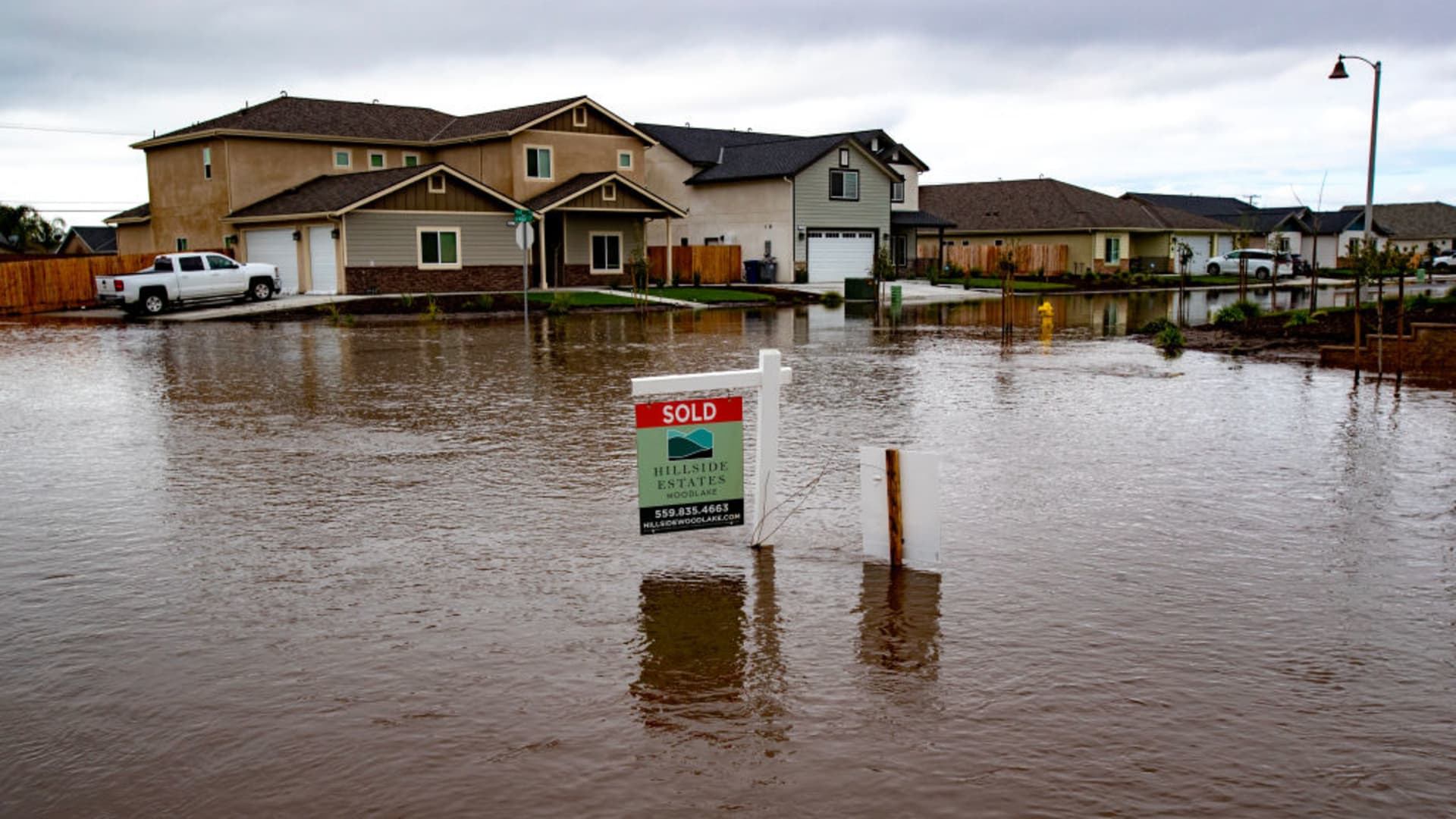 The neighborhood at Hillside Estates is flooded after Tuesday nights heavy rains on March 15, 2023 in Woodlake, California.