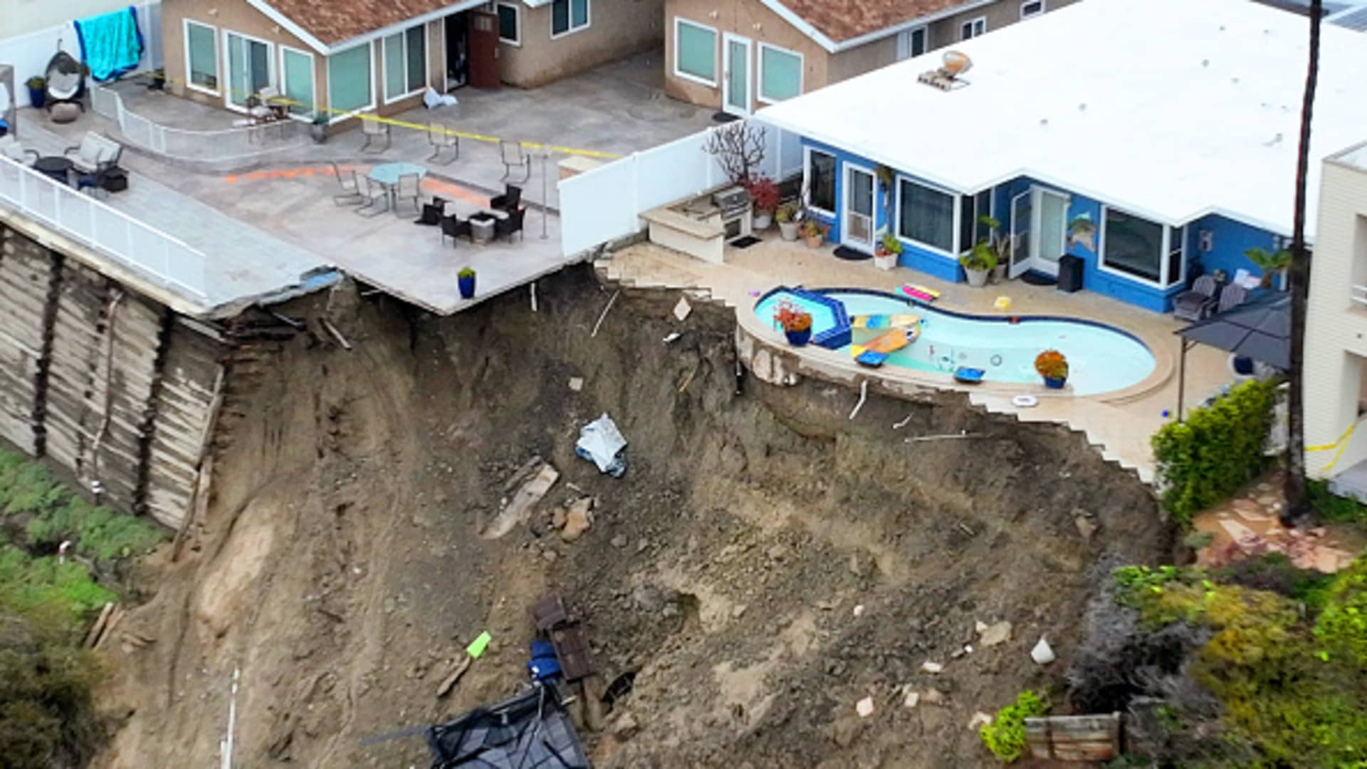 An aerial view of four cliff-side, ocean-view apartment buildings that were evacuated and tagged after heavy rains brought on a landslide that left the rear of the buildings in danger of tumbling down the cliff on Buena Vista in San Clemente Wednesday, March 15, 2023. The bluff is still moving officials said.