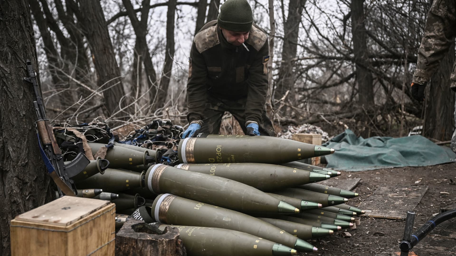 A Ukrainian serviceman prepares 155mm artillery shells near Bakhmut, eastern Ukraine, on March 17, 2023, amid the Russian invasion of Ukraine. 