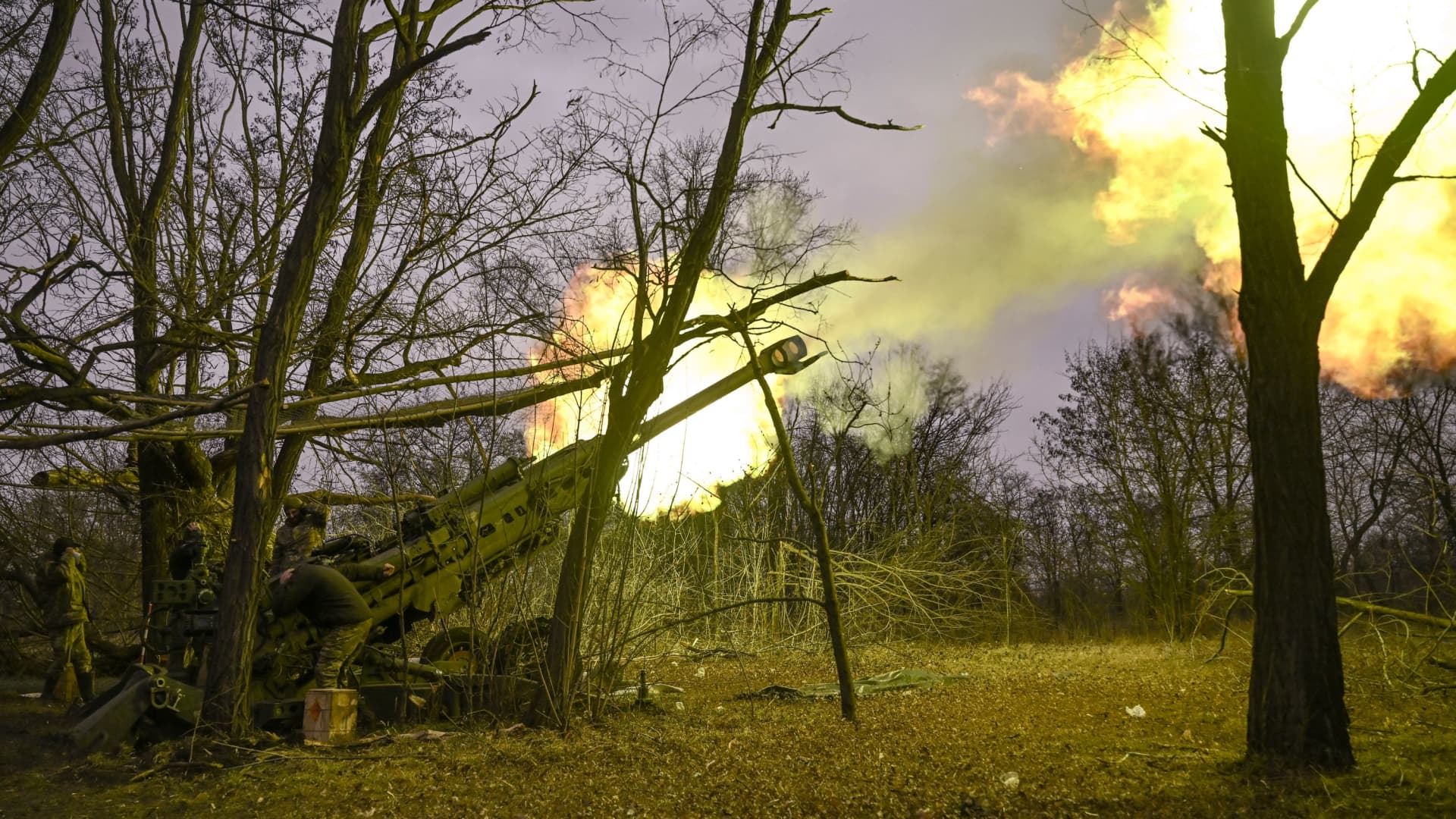Ukrainian servicemen fire a M777 howitzer at Russian positions near Bakhmut, eastern Ukraine, on March 17, 2023, amid the Russian invasion of Ukraine.