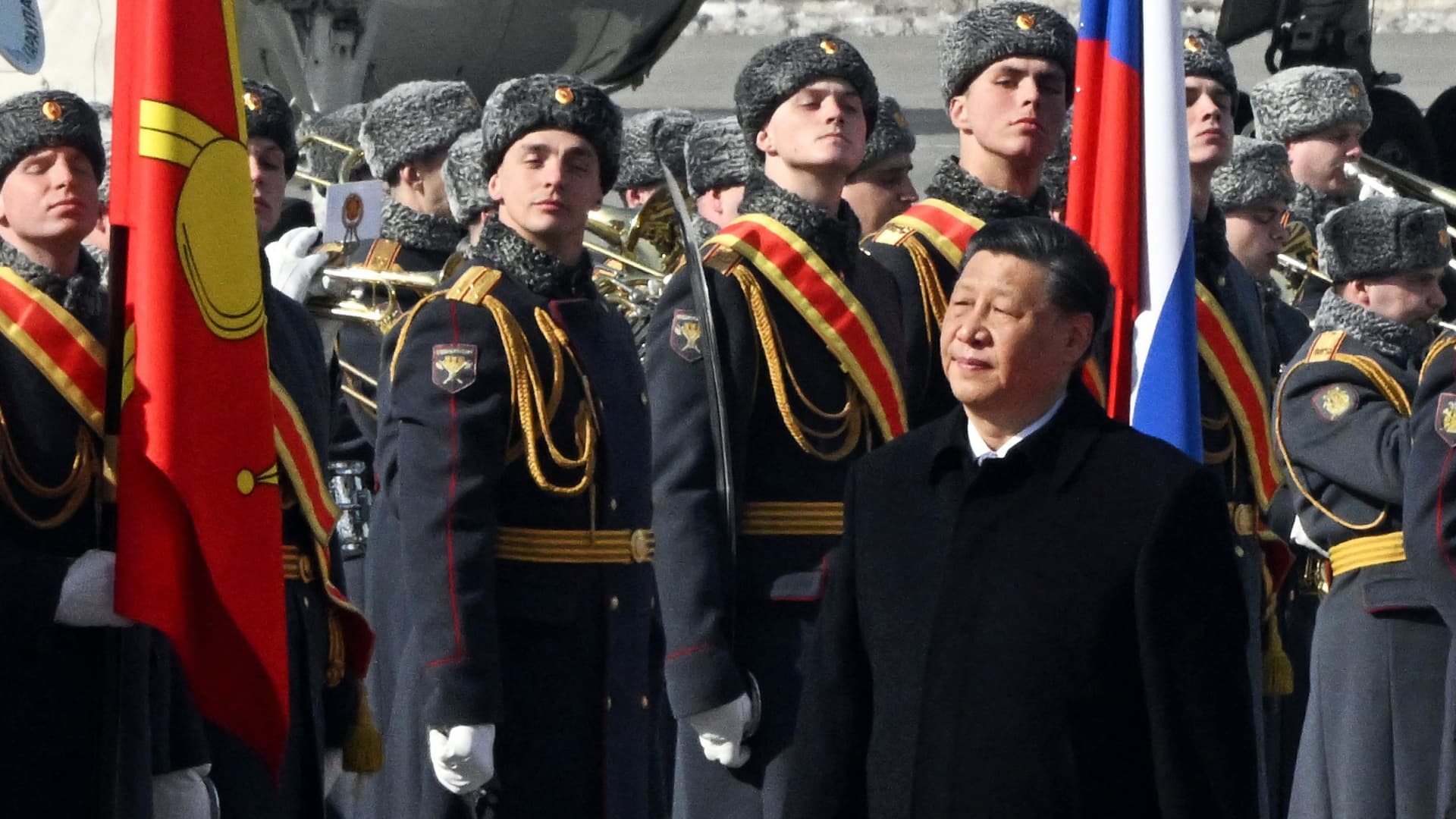 China's President Xi Jinping walks past honour guards during a welcoming ceremony at Moscow's Vnukovo airport on March 20, 2023.