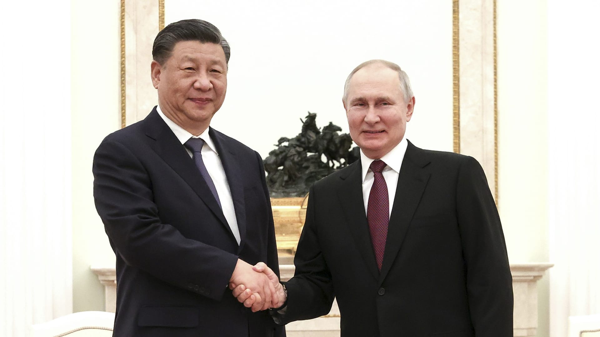 In this grab taken from video, China's President Xi Jinping, left, speaks with Russian President Vladimir Putin during their meeting in Moscow, Russia, Monday, March 20, 2023.