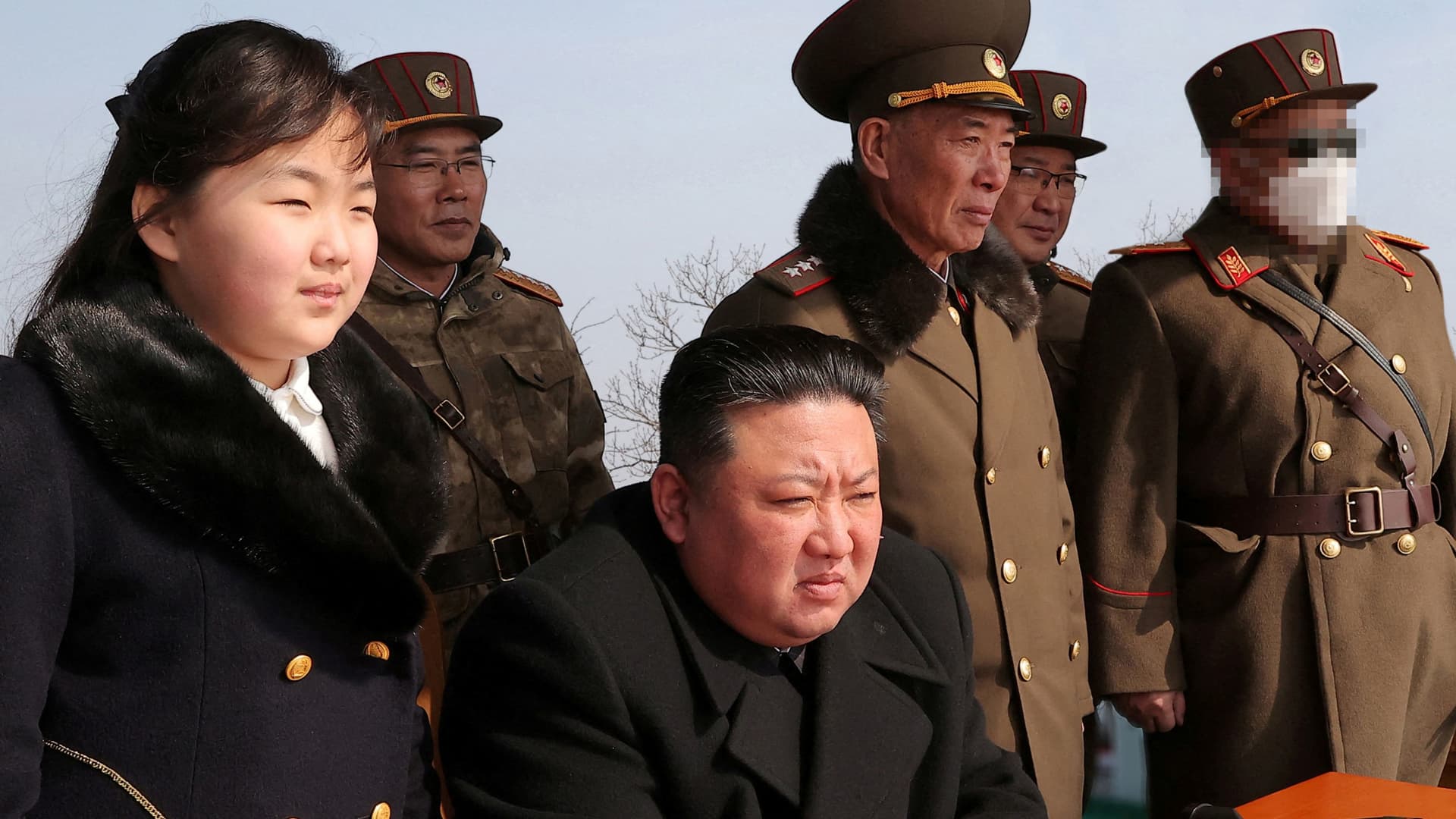 North Korean leader Kim Jong Un and his daughter Kim Ju Ae watch a missile drill at an undisclosed location in this image released by North Korea's Central News Agency (KCNA) on March 20, 2023. 