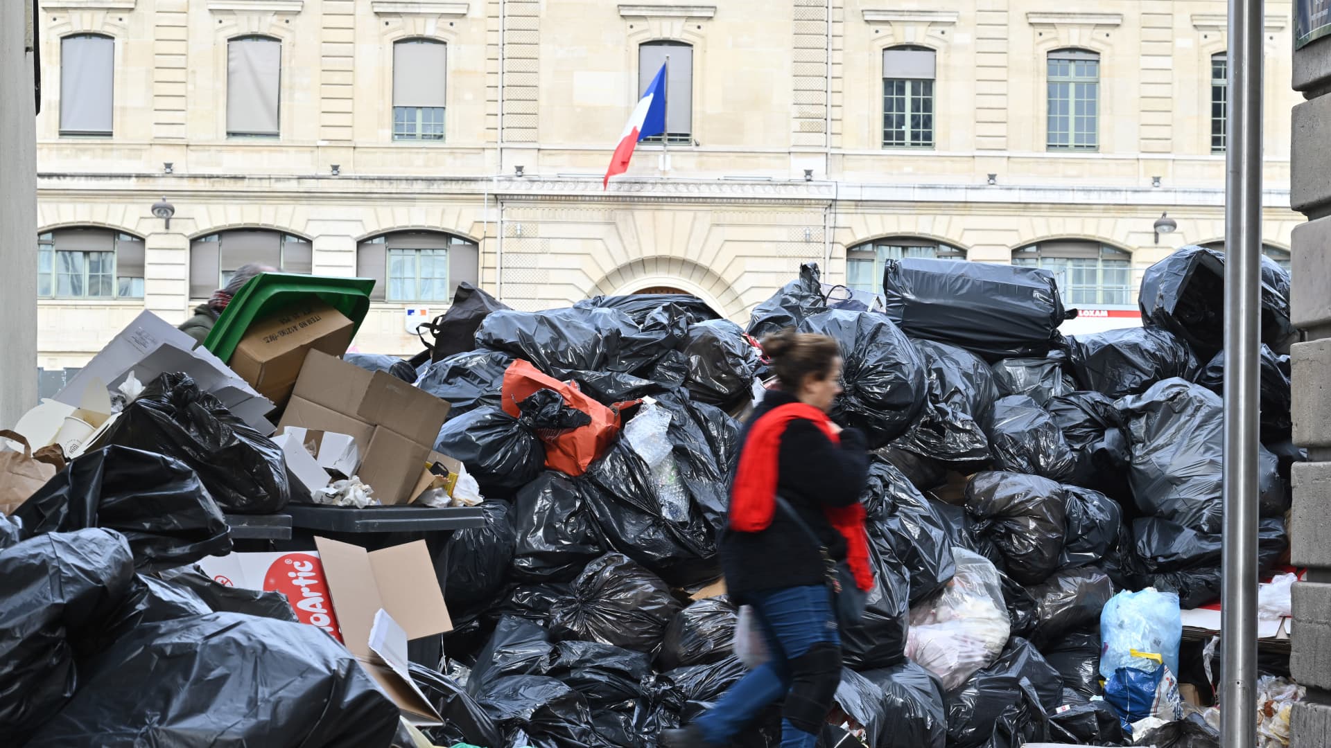 Garbage cans overflowing with trash on the streets as collectors go on strike in Paris, France on March 20, 2023. Garbage collectors have joined the massive strikes throughout France against pension reform plans.