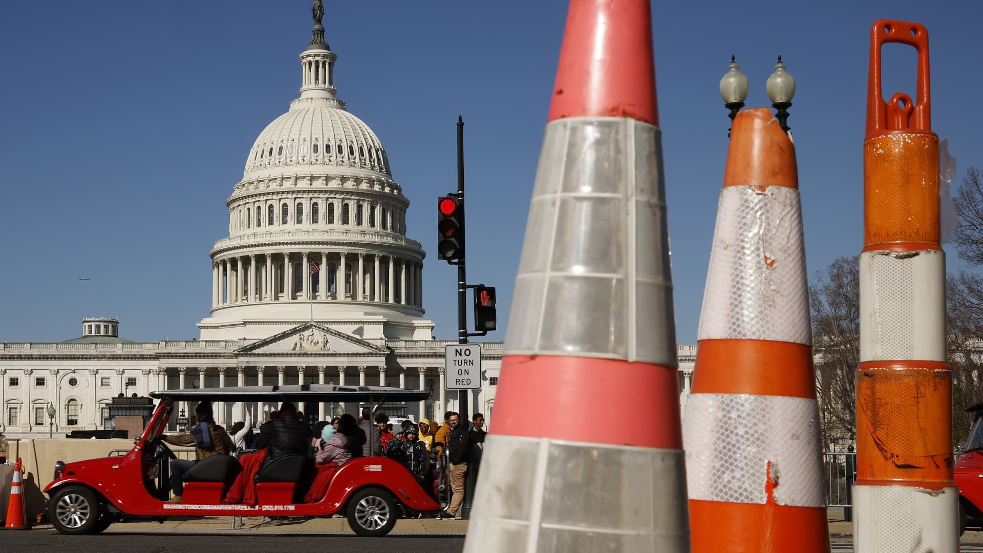 WASHINGTON, DC - MARCH 20: Tourists travel along 1st Street near the East Front of the U.S. Capitol building on March 20, 2023 in Washington, DC.